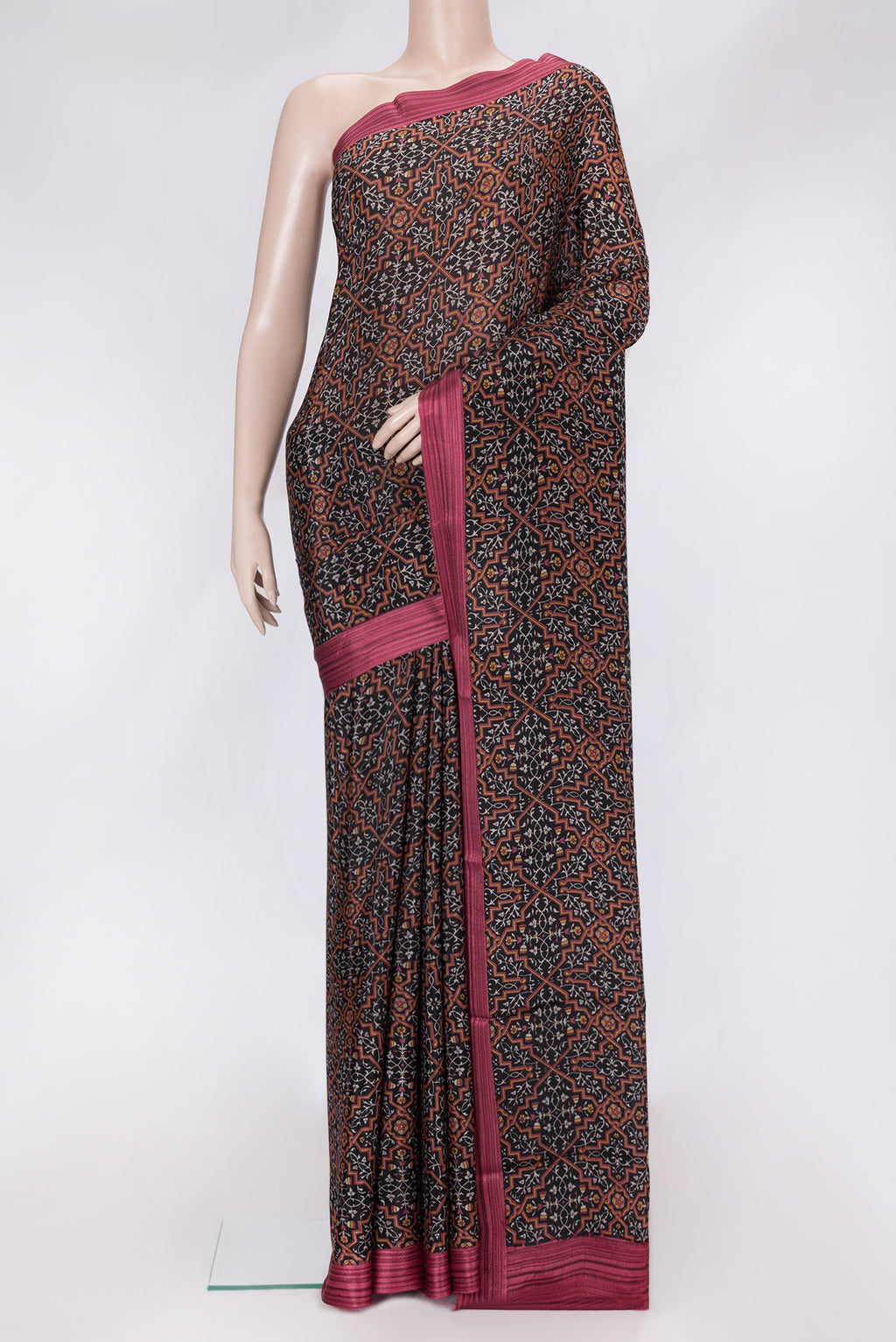 Black Dual Tone Crepe Saree with Printed design on the body and Thread Border.  displayed on a mannequin
