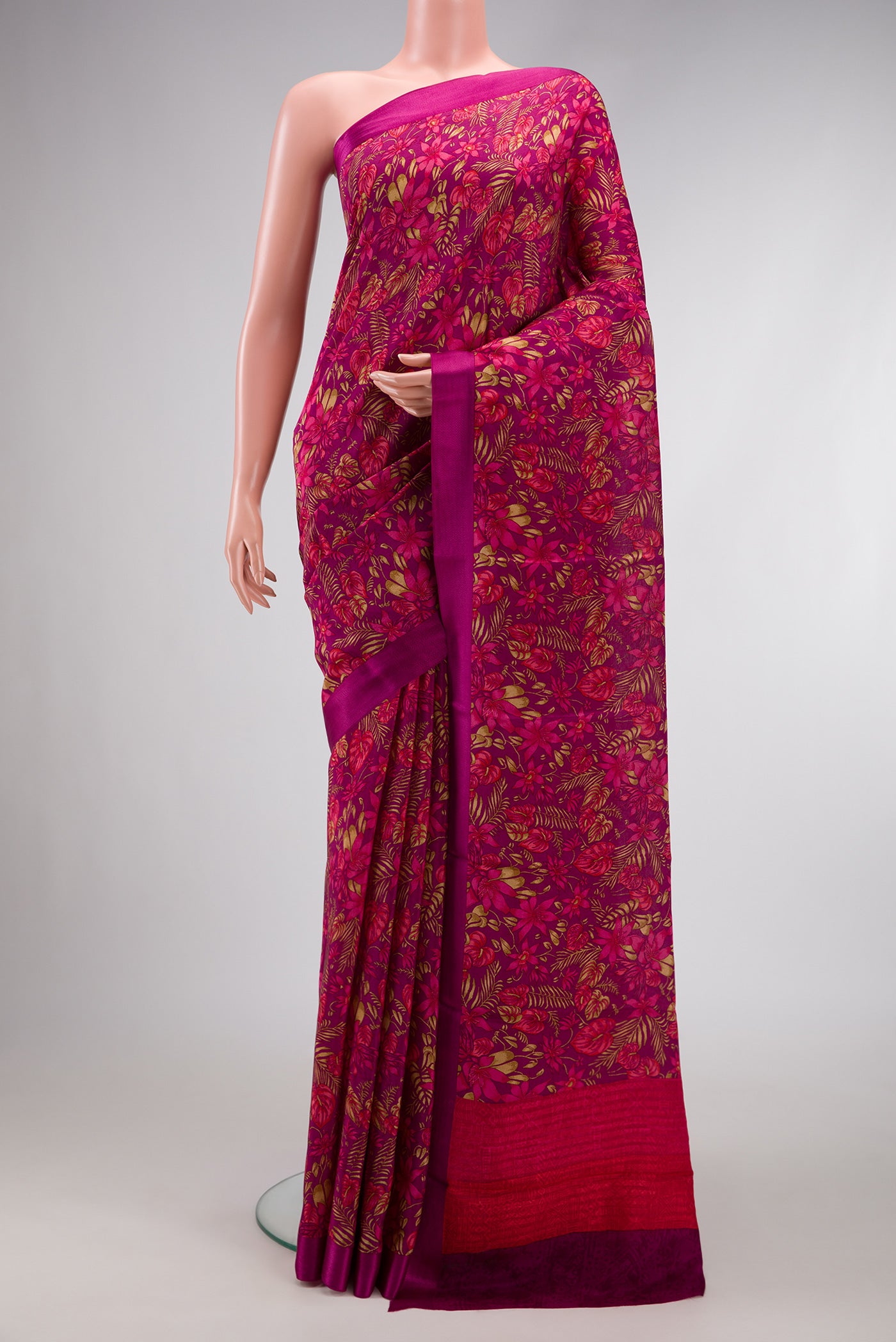 Magenta Dual Tone Mysore Crepe Saree with Printed design on the body and Thread Border.  displayed on a mannequin