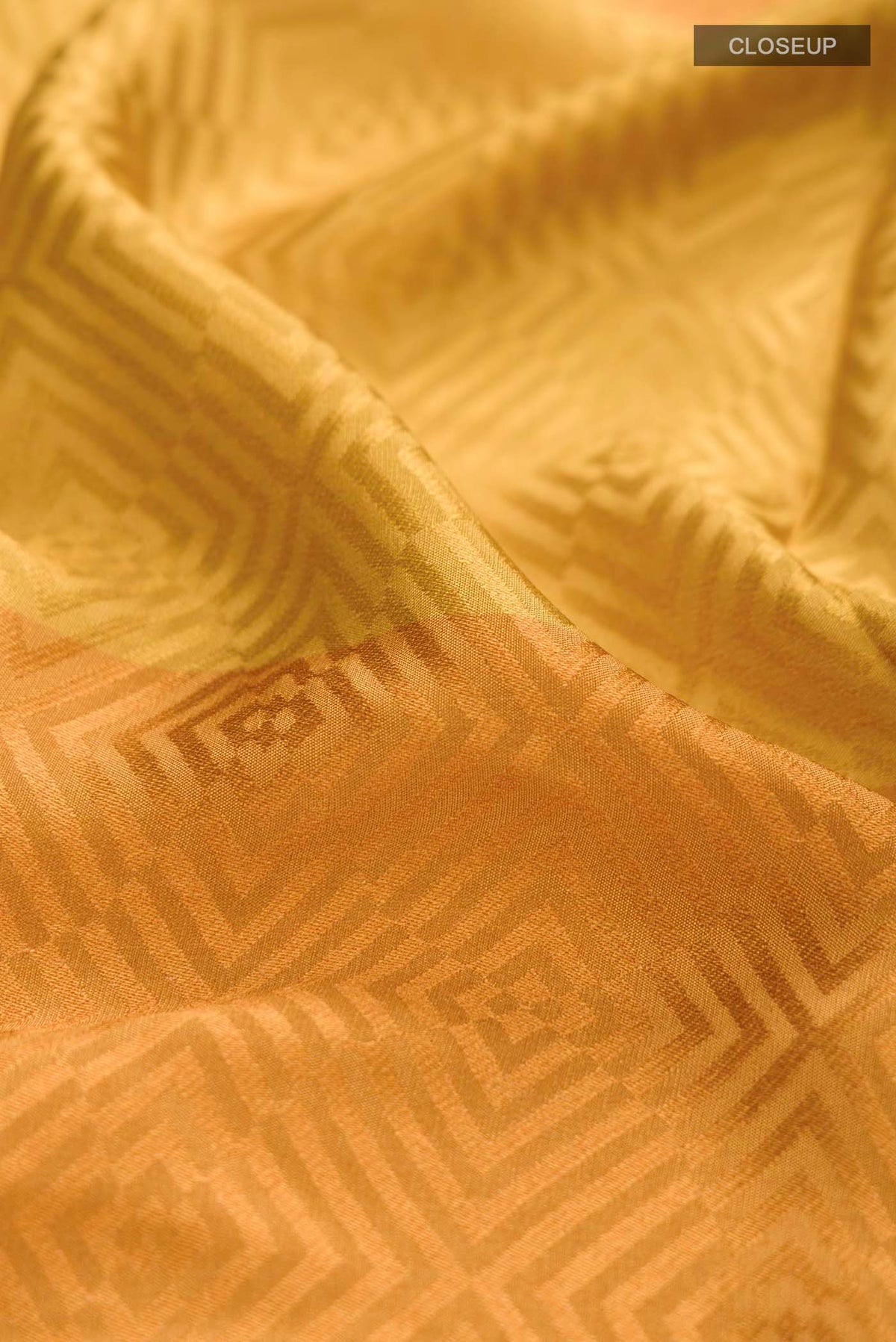 Close up of Multi Color Crepe Saree with Jacquard design on the body and Zari Border displaying folds