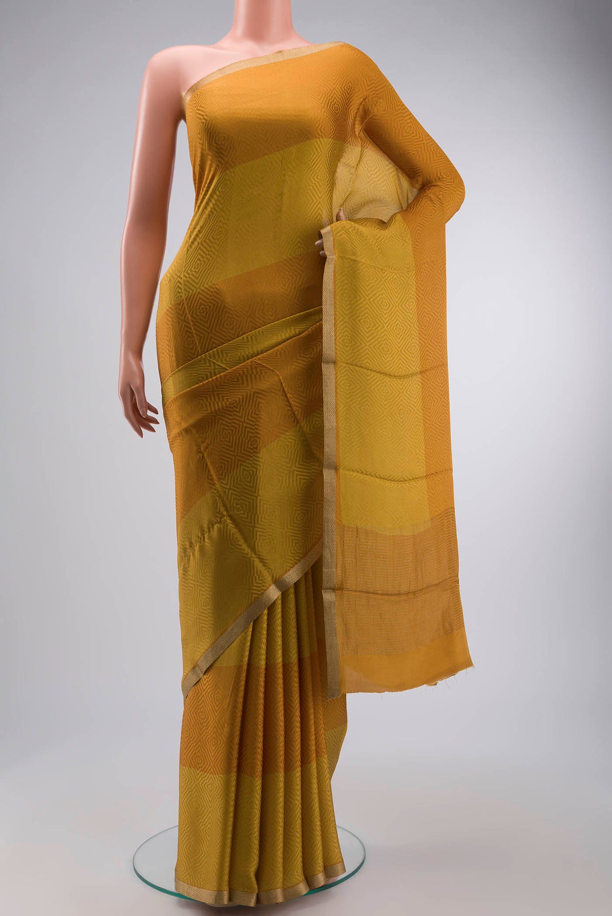 Multi Color Crepe Saree with Jacquard design on the body and Zari Border displayed on a mannequin
