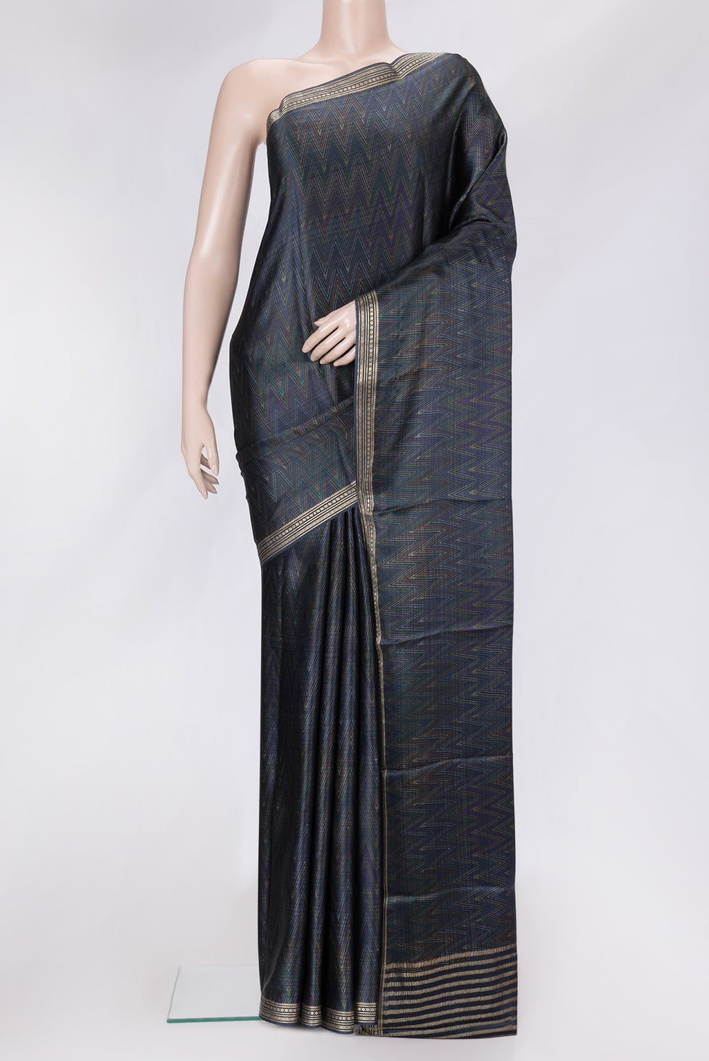 Navy Blue Dual Tone Crepe Saree with Printed design on the body and Zari Border.  displayed on a mannequin