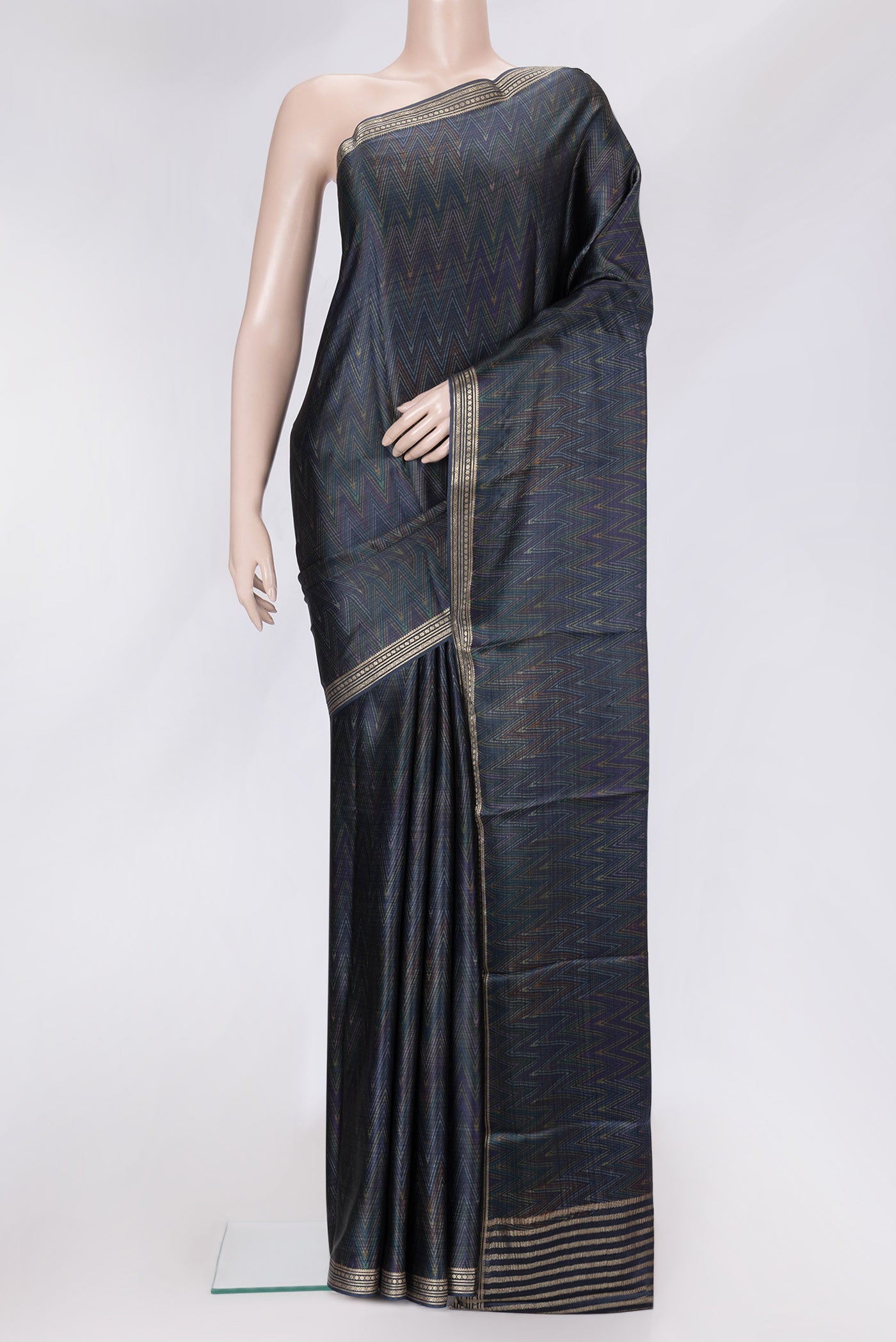 Navy Blue Dual Tone Crepe Saree with Printed design on the body and Zari Border.  displayed on a mannequin