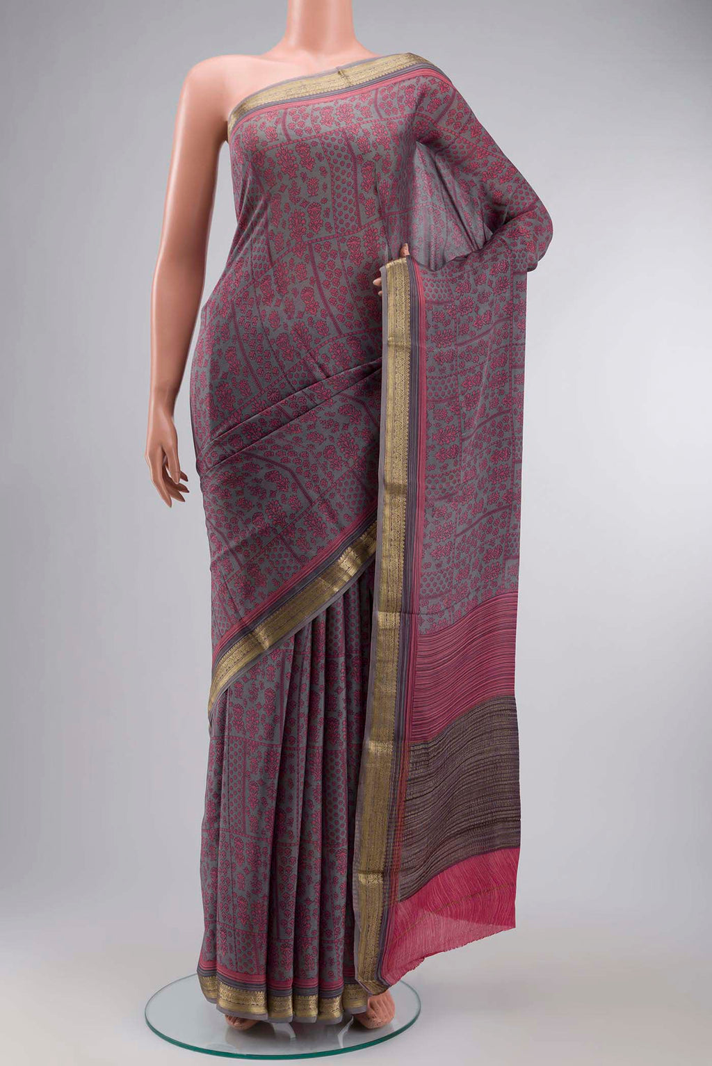 Grey Mysore Crepe Saree with Printed design on the body and Zari Border displayed on a mannequin