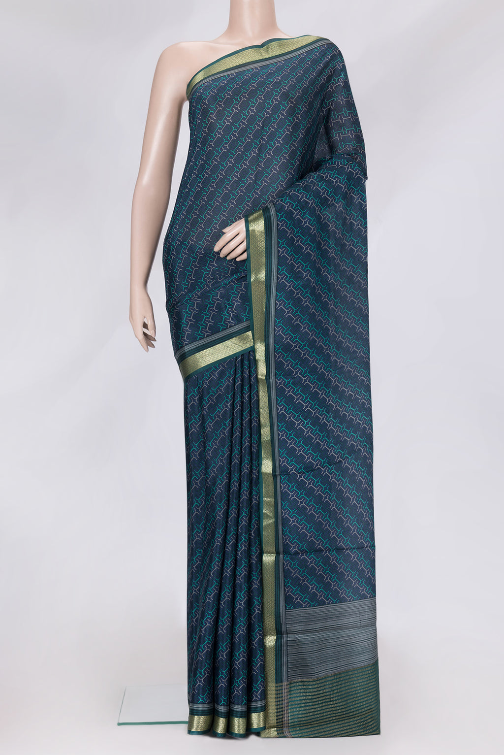 Peacock Blue Dual Tone Crepe Saree with Printed design on the body and Zari Border.  displayed on a mannequin