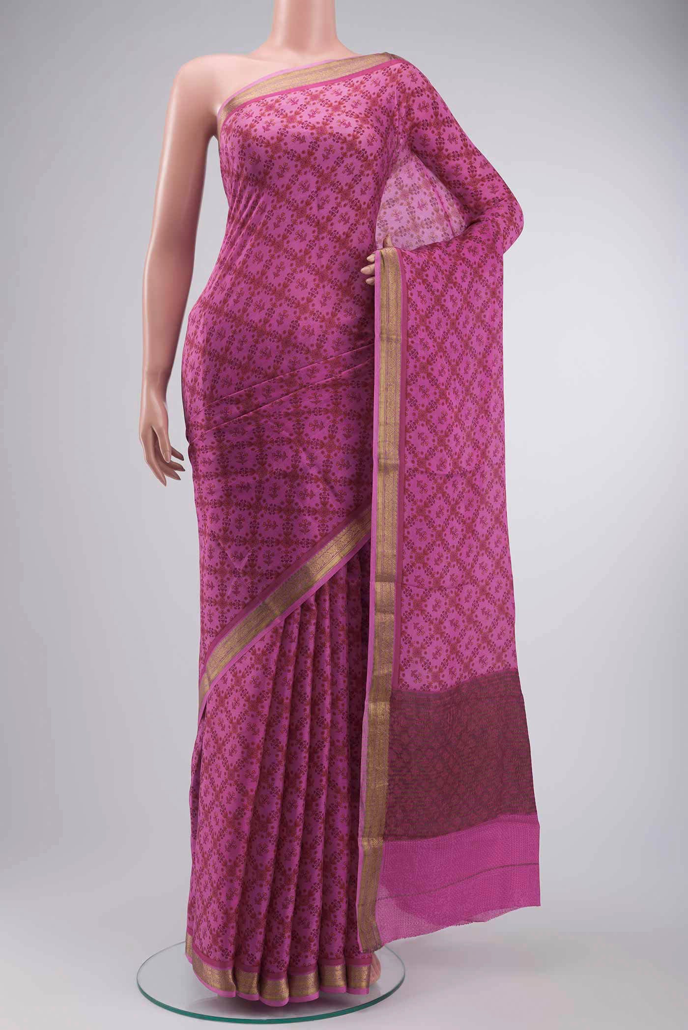 Pink Mysore Crepe Saree with Printed design on the body and Zari Border displayed on a mannequin