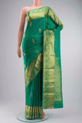 Green Kanchipuram Silk Saree with Zari Butta on the body and Zari Border displayed on a mannequin