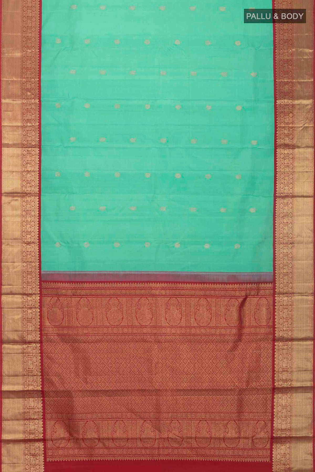 Flat view of Green Kanchipuram Silk Saree with Zari Butta on the body and Zari Border