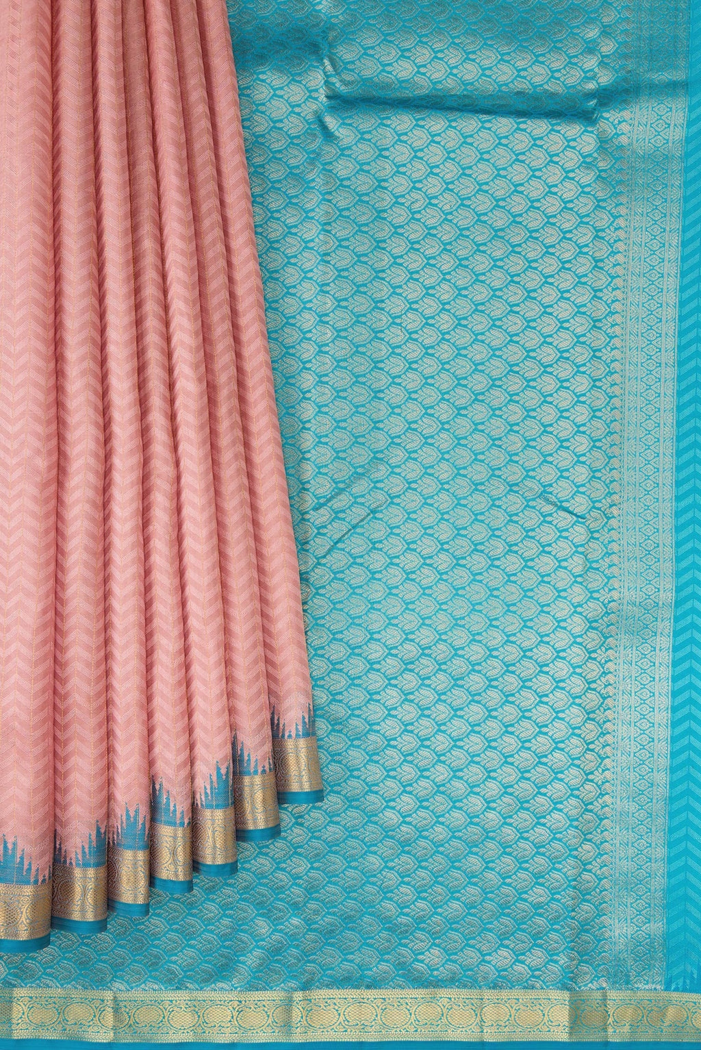 Pleats and pallu of Rose Gold Kanjivaram Silk Saree with Jacquard design on the body and Temple Border. 