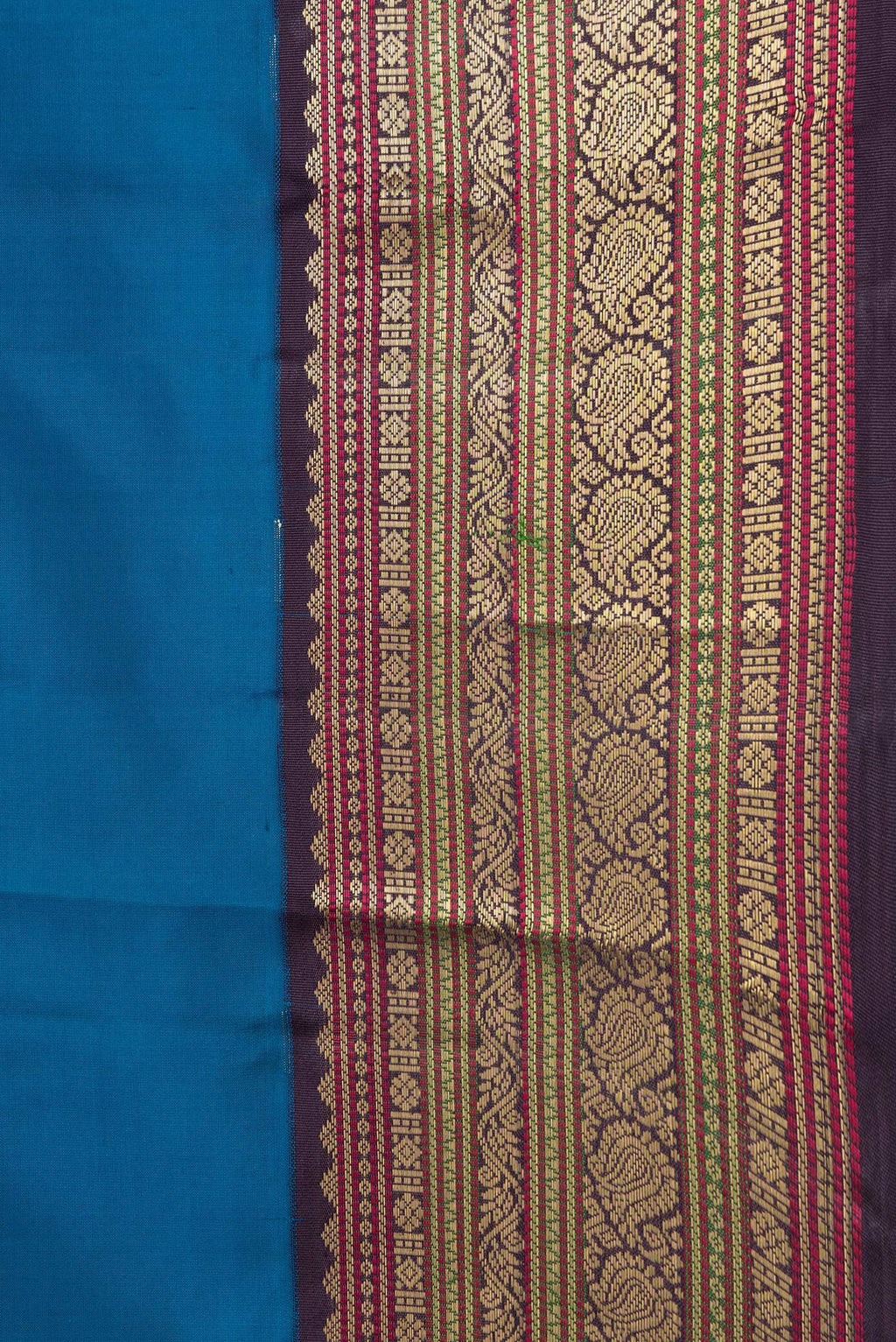 Border image of Peacock Blue Dual Tone Kanchipuram Silk Saree with Zari Butta on the body and Zari Border. 