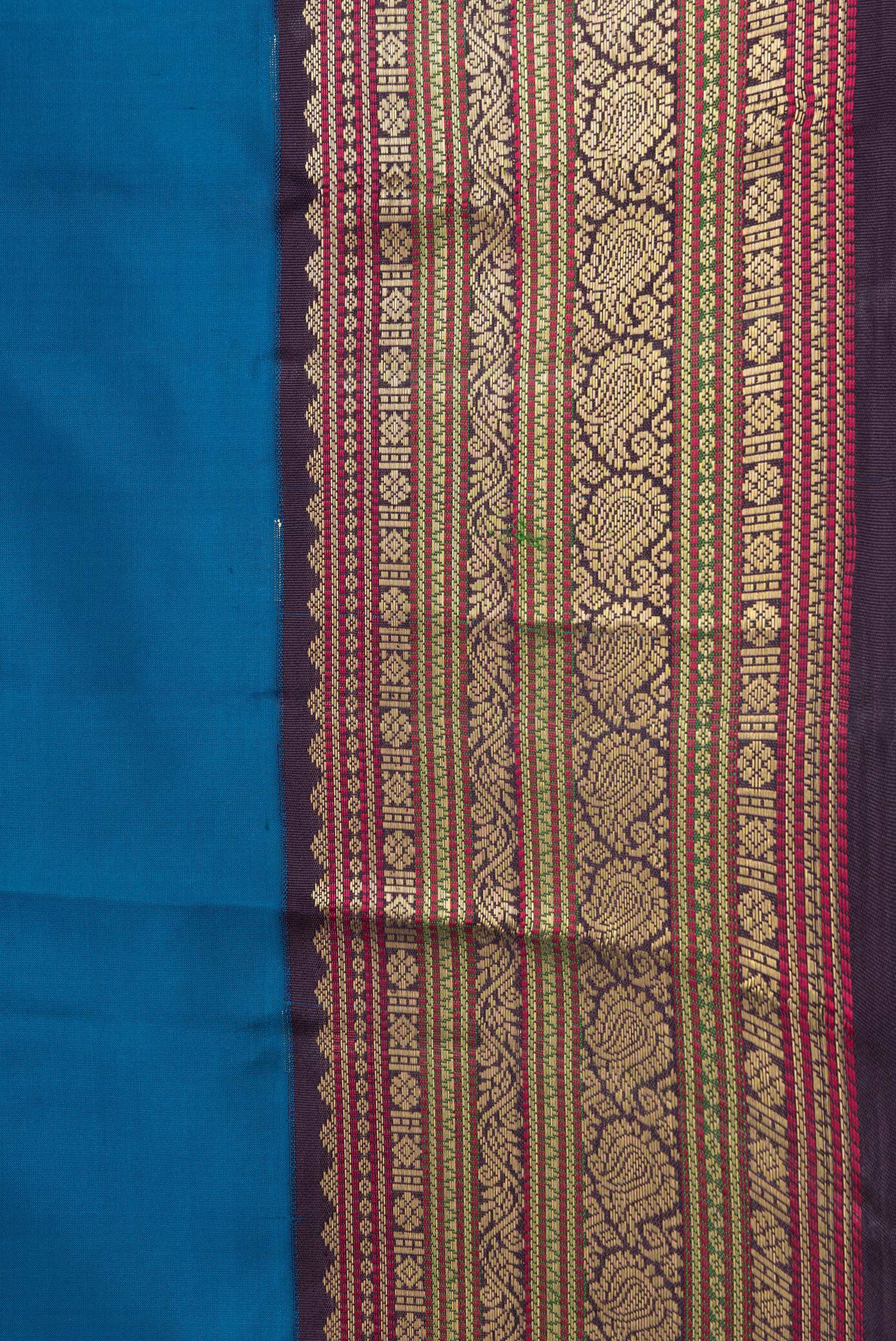 Border image of Peacock Blue Dual Tone Kanchipuram Silk Saree with Zari Butta on the body and Zari Border. 