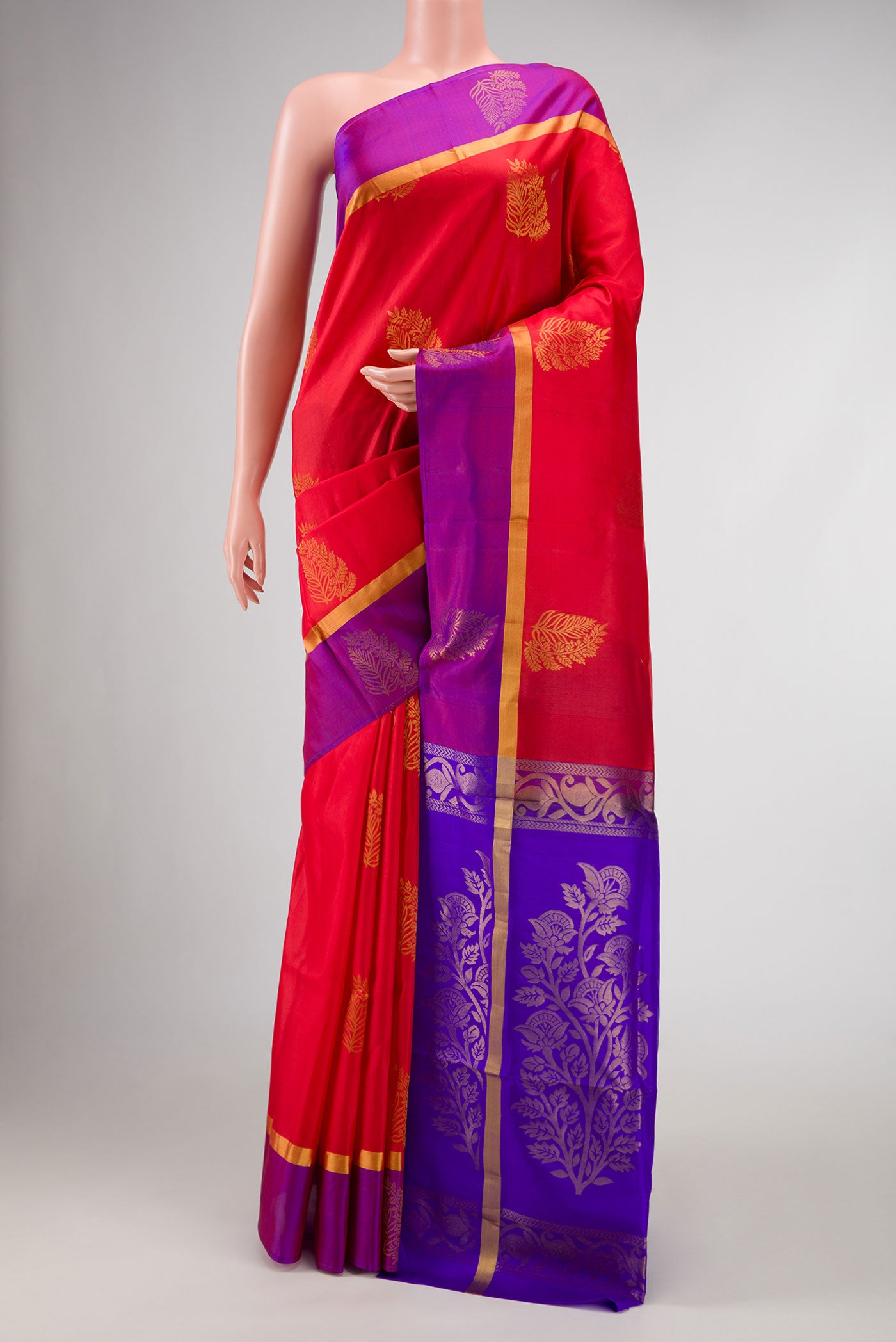 Red Dual Tone Soft Silk Saree with Zari Butta on the body and Zari Border.  displayed on a mannequin