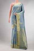 Grey Dual Tone Kanchipuram Silk Saree with Zari Butta on the body and Zari Border displayed on a mannequin