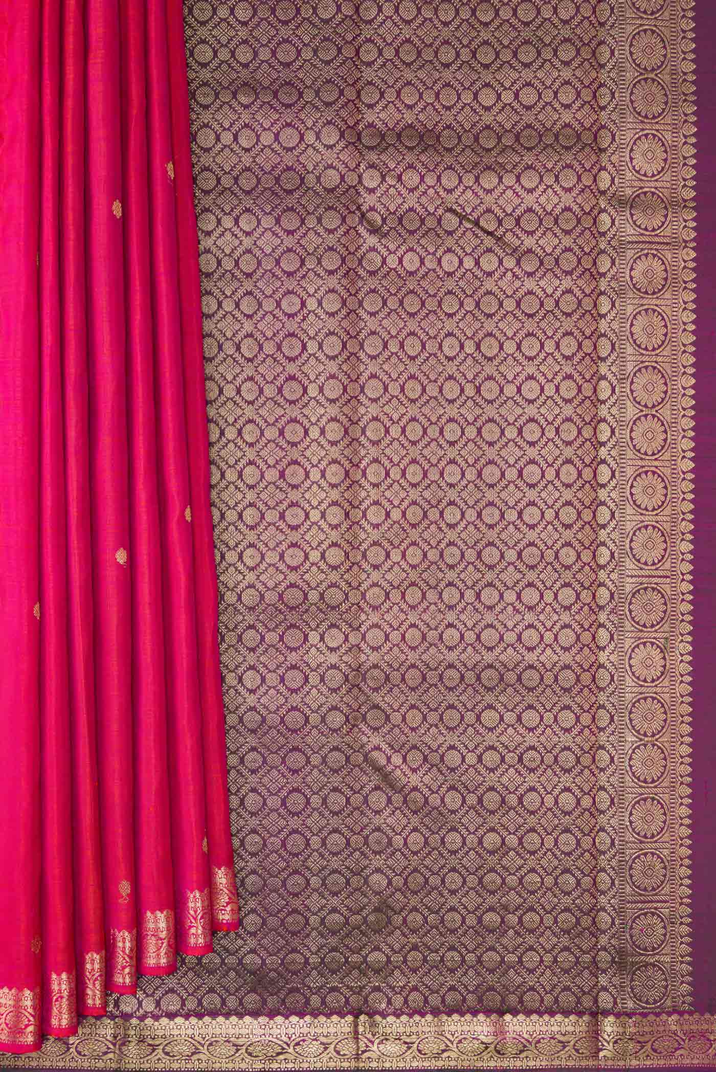 Pleats and pallu of Coral Dual Tone Kanjivaram Silk Saree with Zari Butta on the body and Zari Border. 