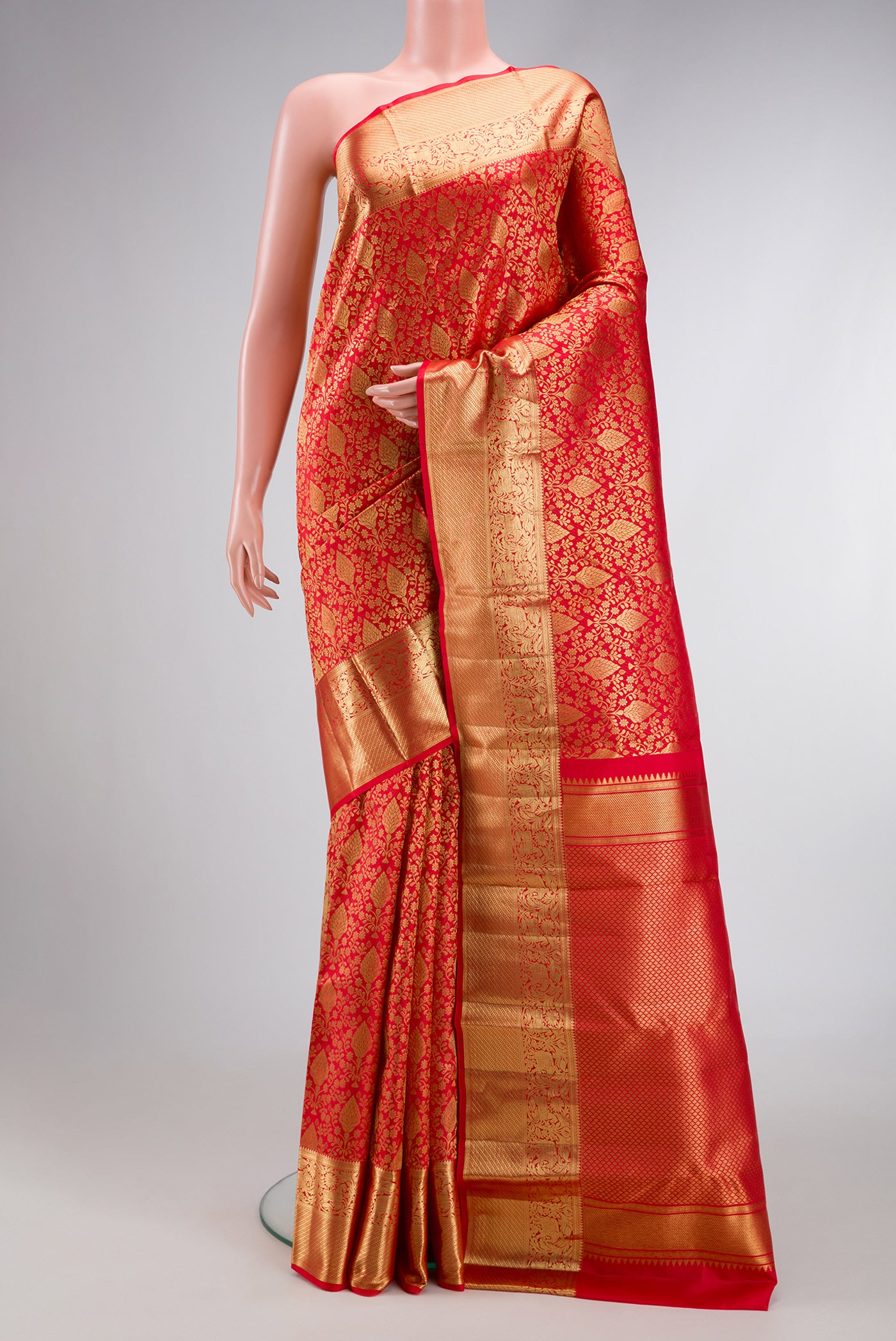 Red Dual Tone Kanchipuram Silk Saree with Zari Brocade on the body and Zari Border.  displayed on a mannequin
