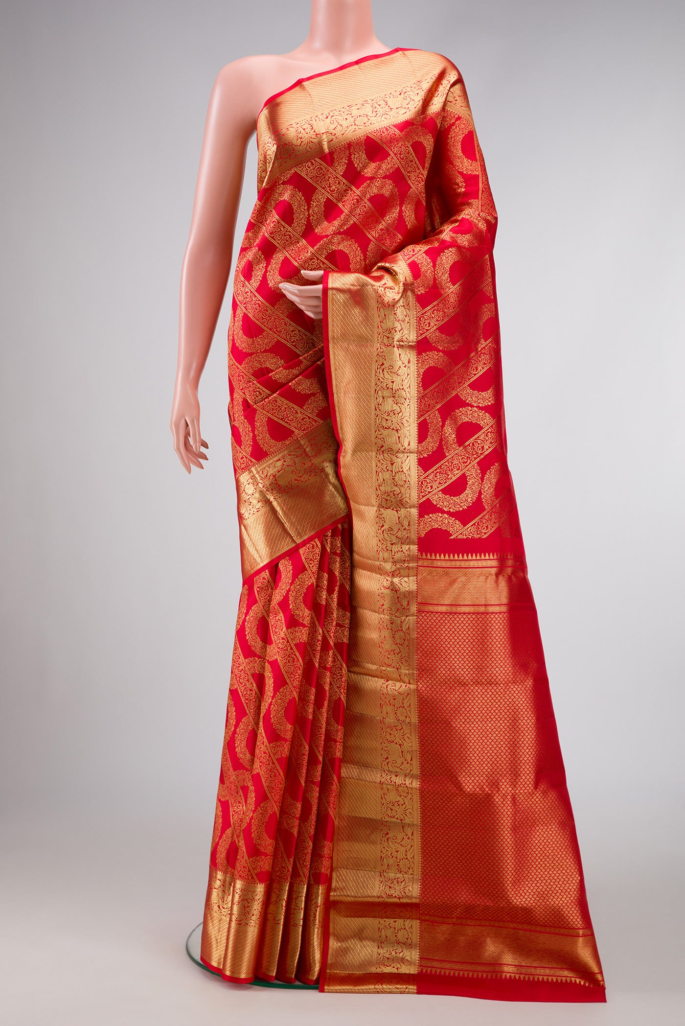 Red Dual Tone Kanchipuram Silk Saree with Zari Brocade on the body and Zari Border.  displayed on a mannequin