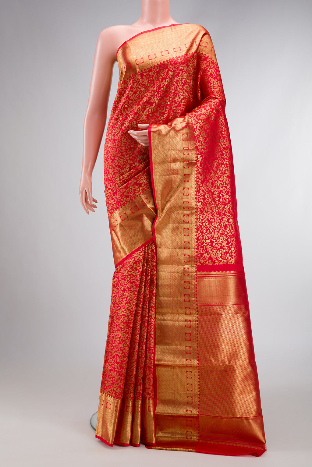 Red Dual Tone Kanchipuram Silk Saree with Zari Brocade on the body and Zari Border.  displayed on a mannequin