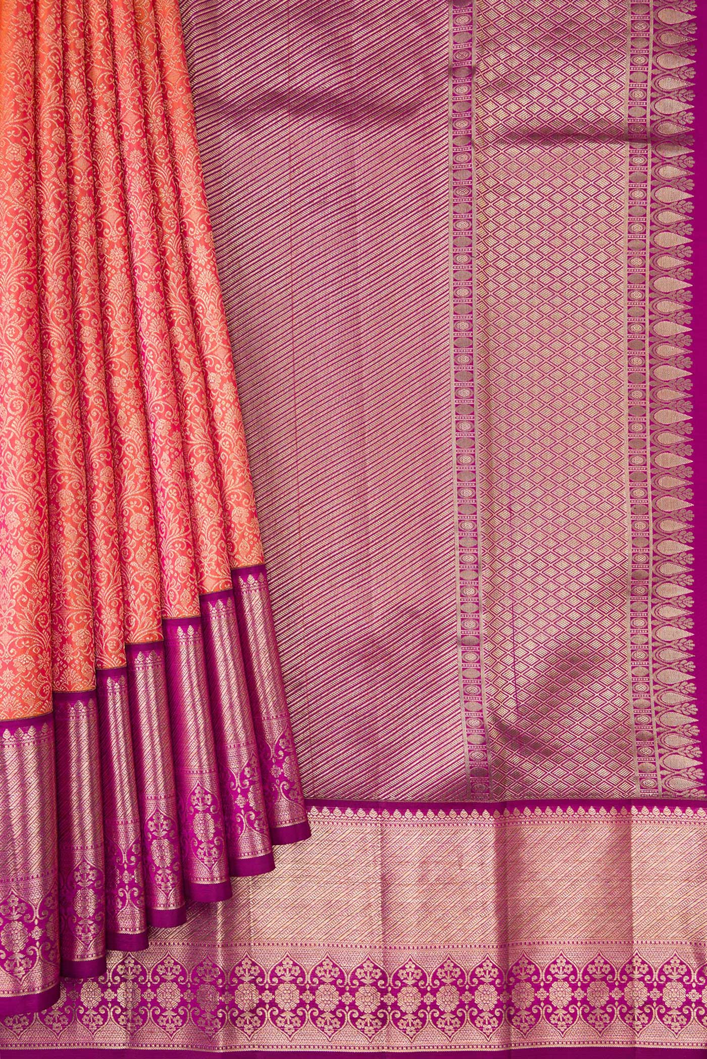 Pleats and pallu of Brick Orange Dual Tone Kanchipuram Silk Saree with Zari Brocade on the body and Fancy Border. 