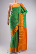 Green Kanchipuram Silk Saree with Zari Brocade on the body and Zari Border displayed on a mannequin