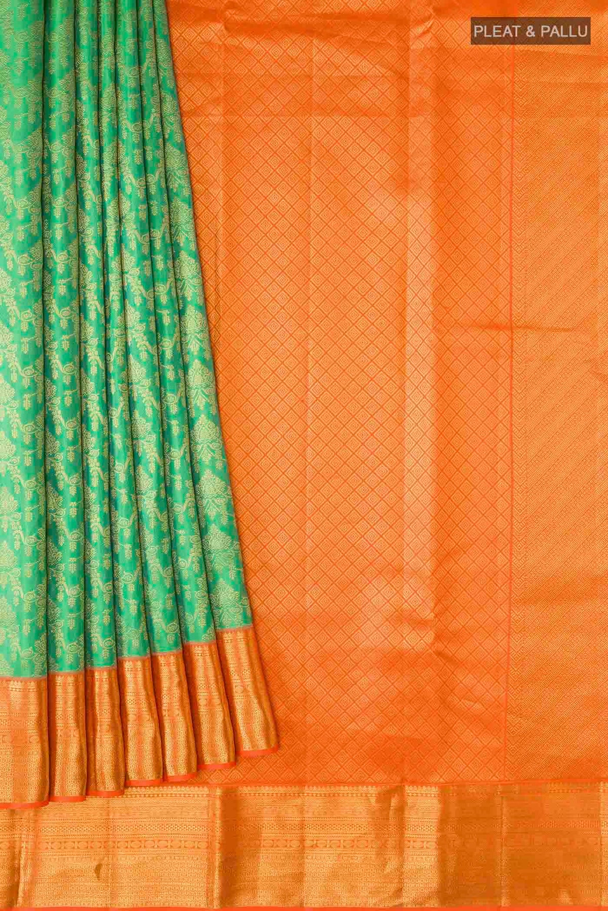 Pleats and pallu of Green Kanchipuram Silk Saree with Zari Brocade on the body and Zari Border