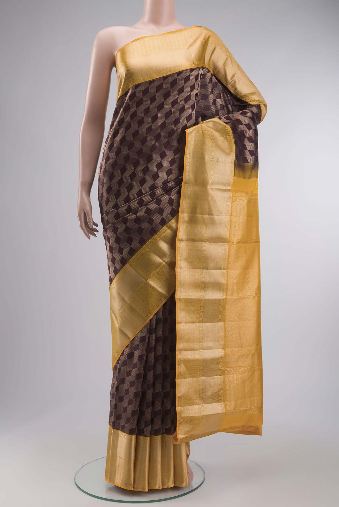 Brown Kanchipuram Silk Saree with Zari Brocade on the body and Zari Border displayed on a mannequin