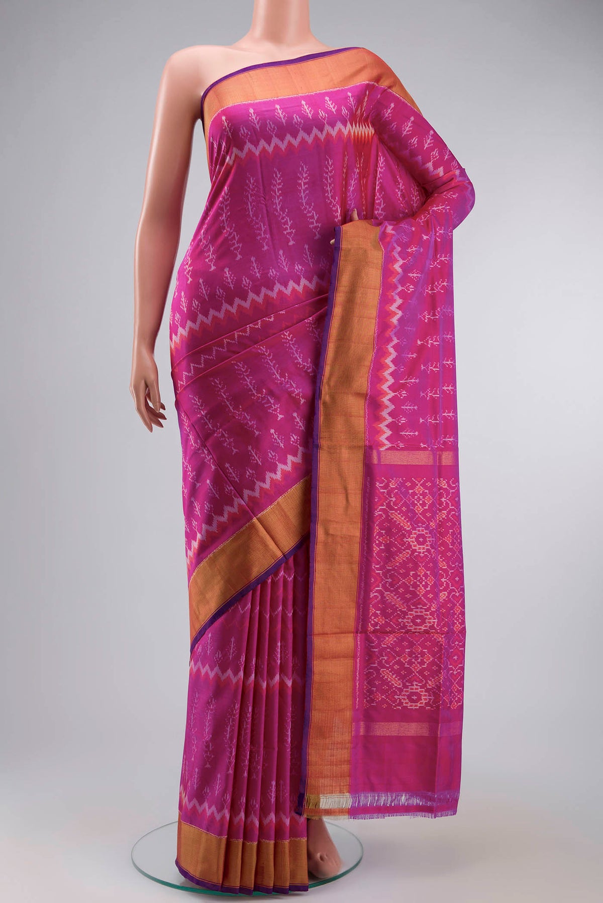 Pink Pochampally Silk Saree with Pure Ikat on the body and Zari Border displayed on a mannequin