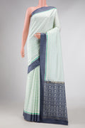 Off White Dual Tone Double Ikat Saree with Ikat Print on the body and Zari Border displayed on a mannequin