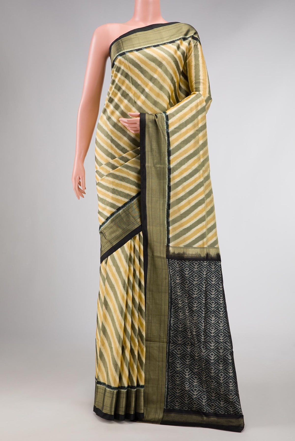 Sandal and Grey Color Double Ikat Saree with Ikat Print on the body and Zari Border displayed on a mannequin