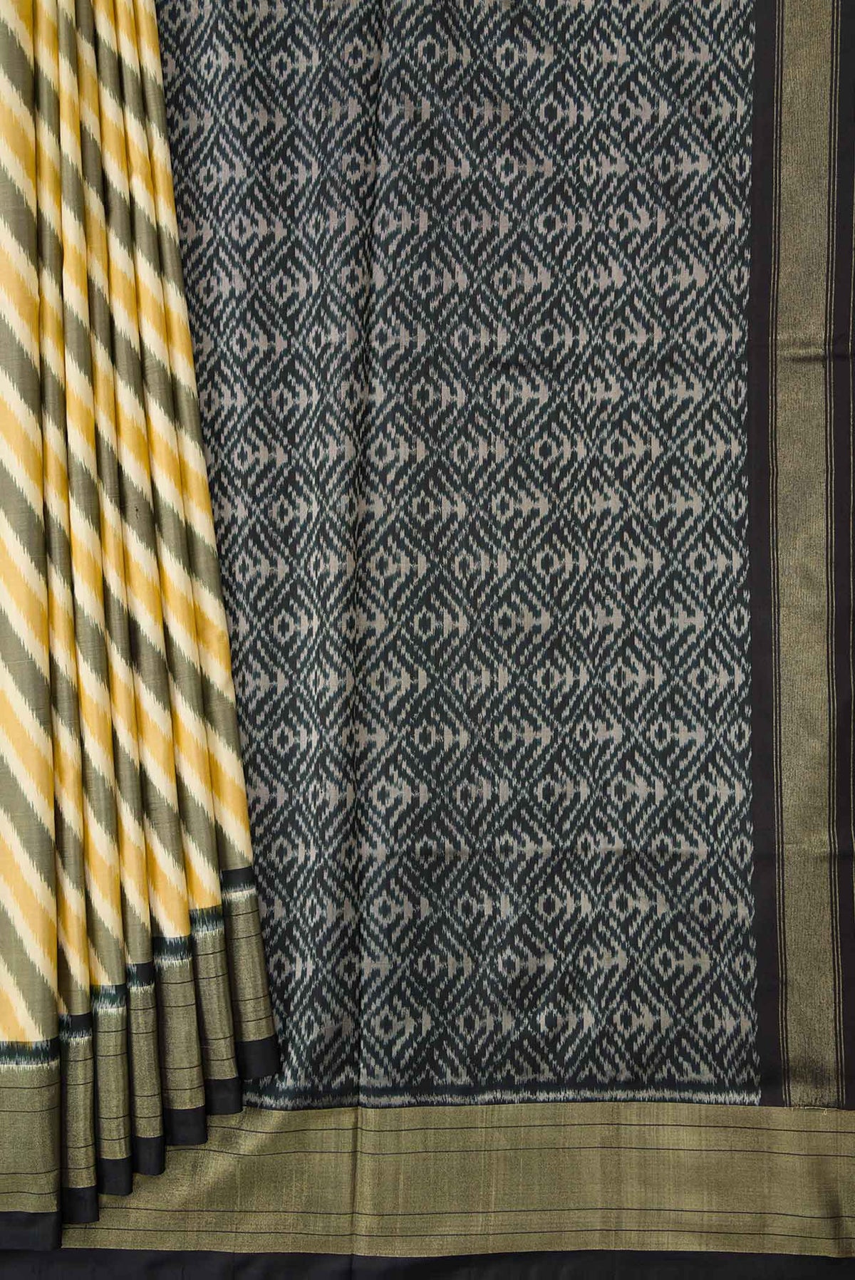 Pleats and pallu of Sandal and Grey Color Double Ikat Saree with Ikat Print on the body and Zari Border