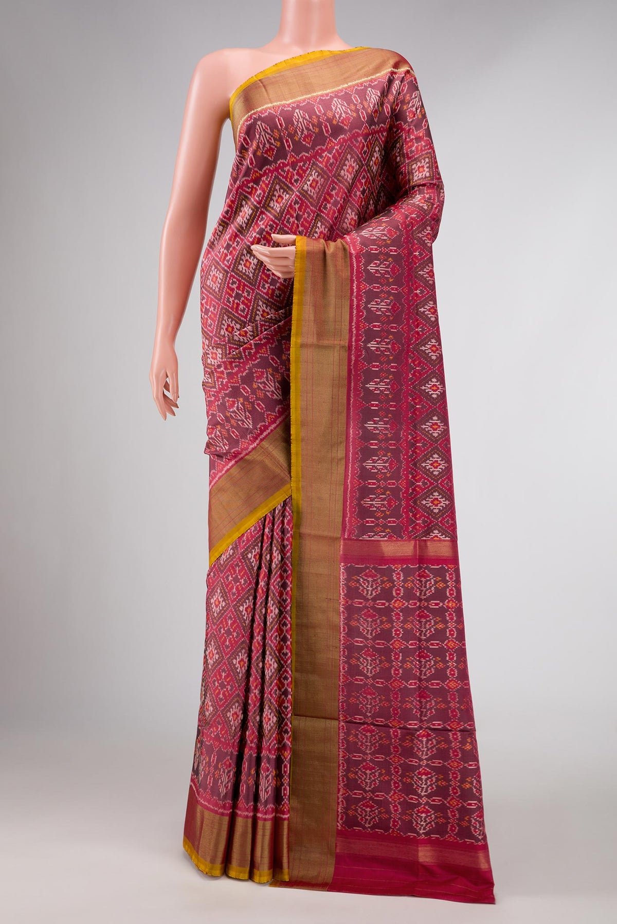 Dark Mauve Dual Tone Double Ikat Saree with Ikat Print on the body and Zari Border displayed on a mannequin