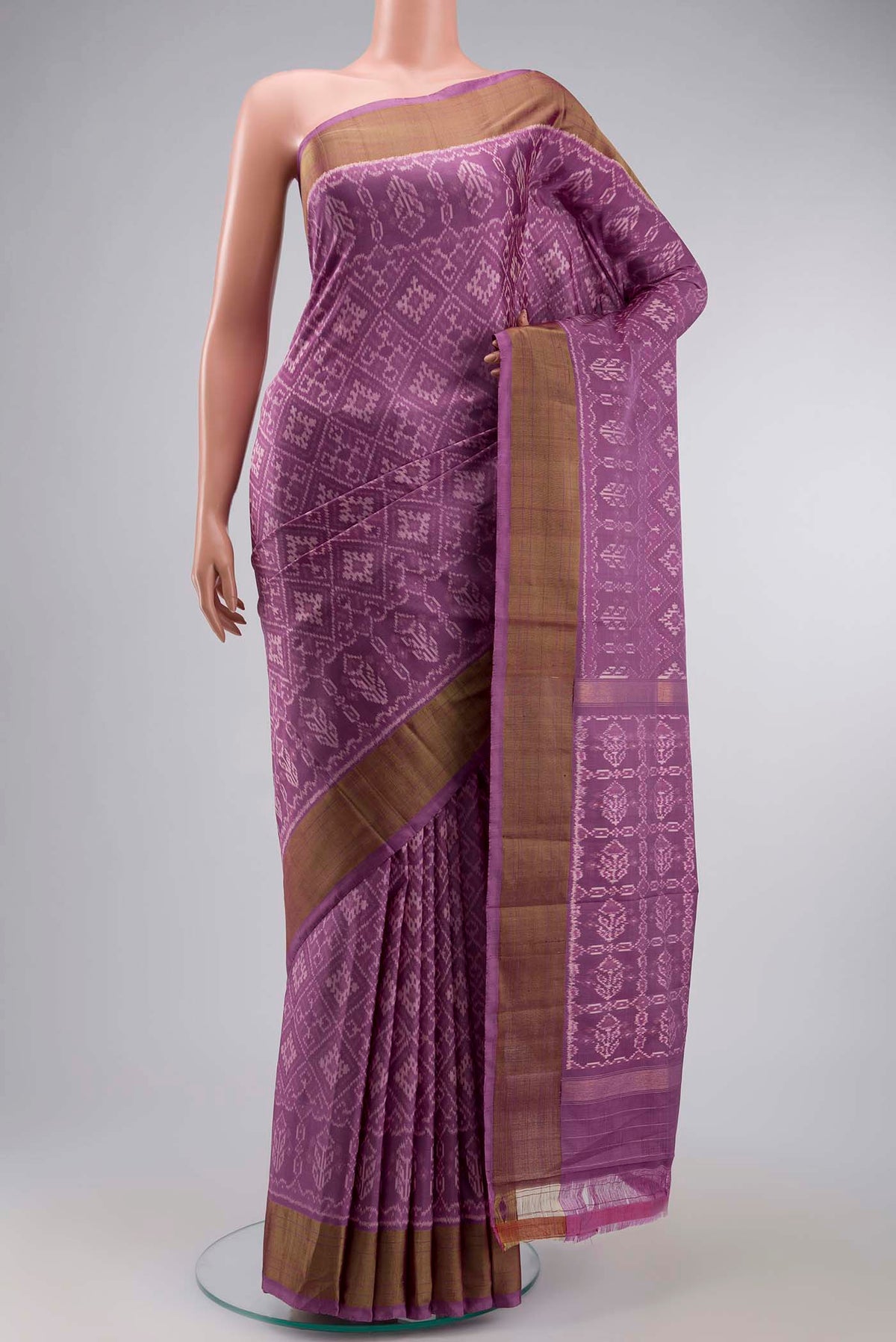 Lavender Pochampally Silk Saree with Pure Ikat on the body and Zari Border displayed on a mannequin
