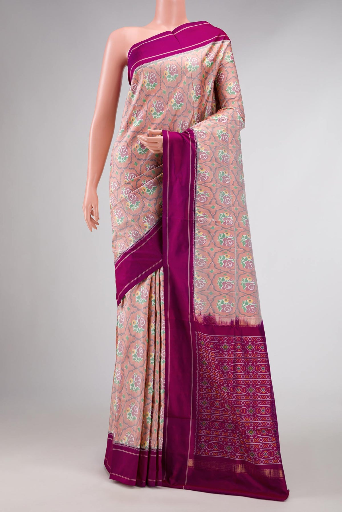 Golden Peach Dual Tone Double Ikat Saree with Ikat Print on the body and Plain Border displayed on a mannequin