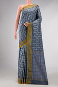 Grey Dual Tone Double Ikat Saree with Ikat Print on the body and Zari Border displayed on a mannequin
