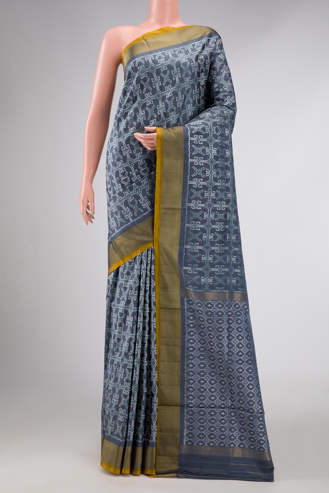 Grey Dual Tone Double Ikat Saree with Ikat Print on the body and Zari Border displayed on a mannequin