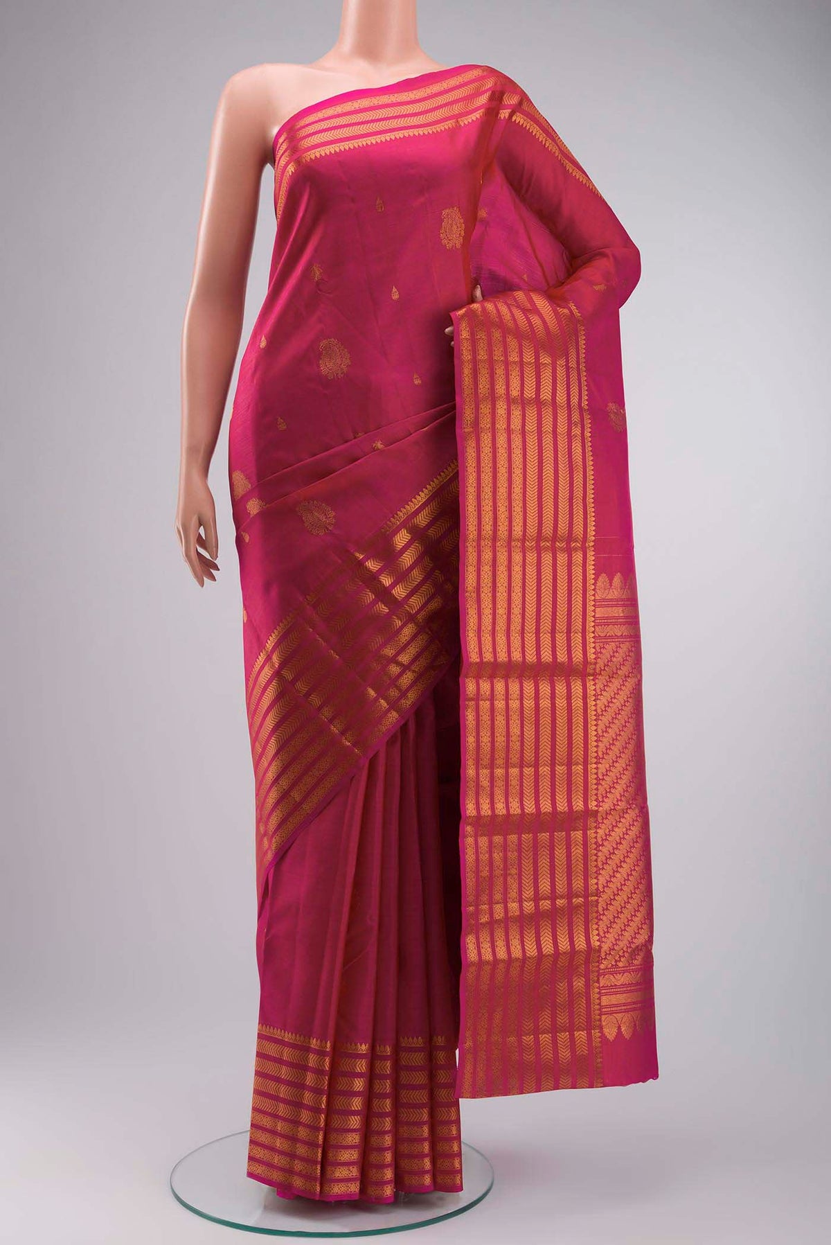 Pink Kanchipuram Silk Saree with Zari Butta on the body and Zari Border displayed on a mannequin