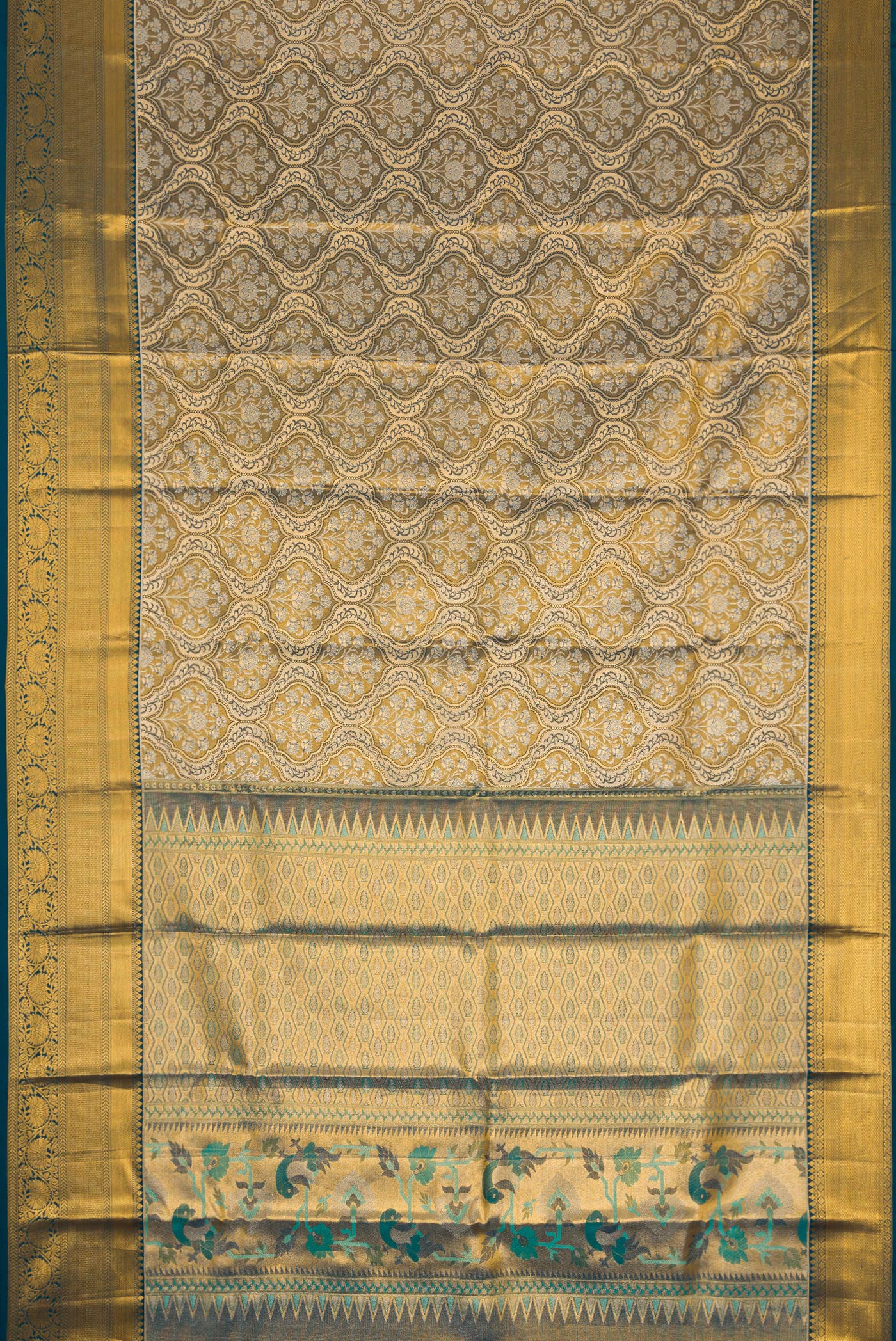 Flat view of Mehandi Green Dual Tone Kanchipuram Tissue Silk Saree with Zari Brocade on the body and Zari Border. 