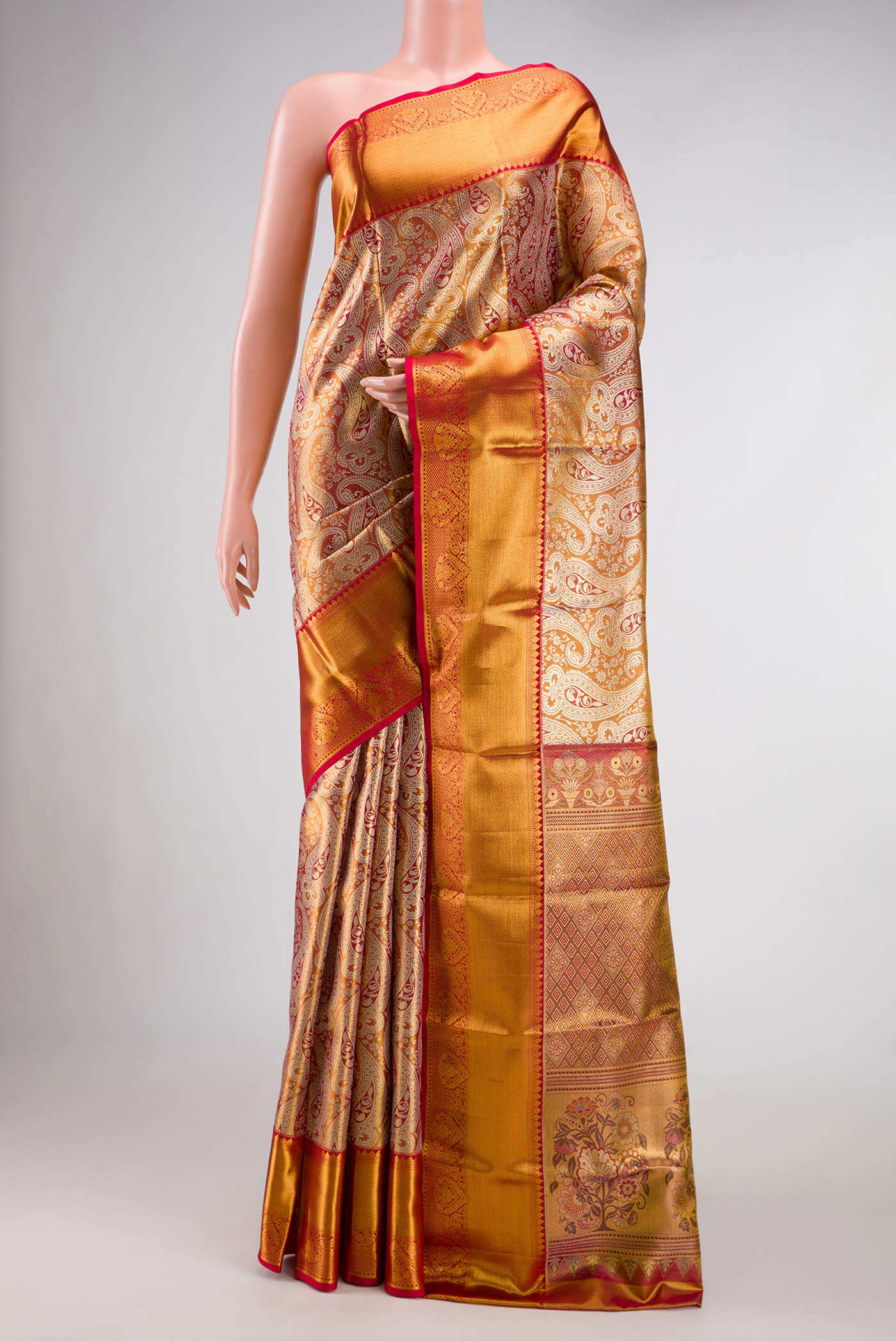 Gold Dual Tone Kanchipuram Tissue Silk Saree with Zari Brocade on the body and Zari Border.  displayed on a mannequin
