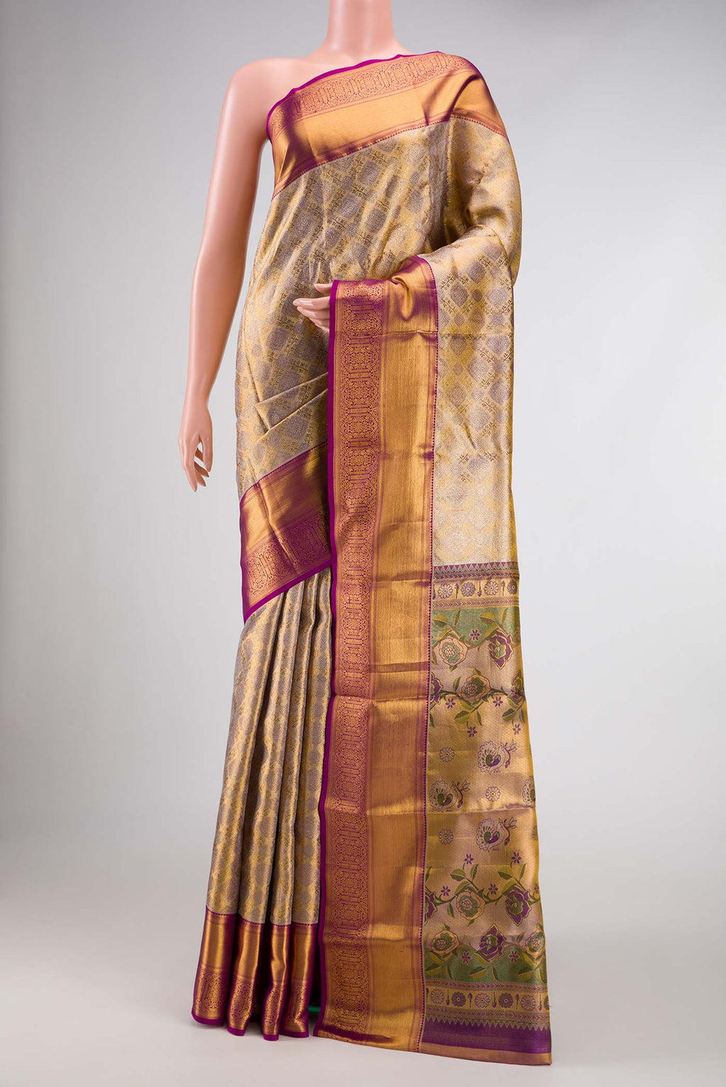 Gold Dual Tone Kanchipuram Tissue Silk Saree with Zari Brocade on the body and Zari Border.  displayed on a mannequin