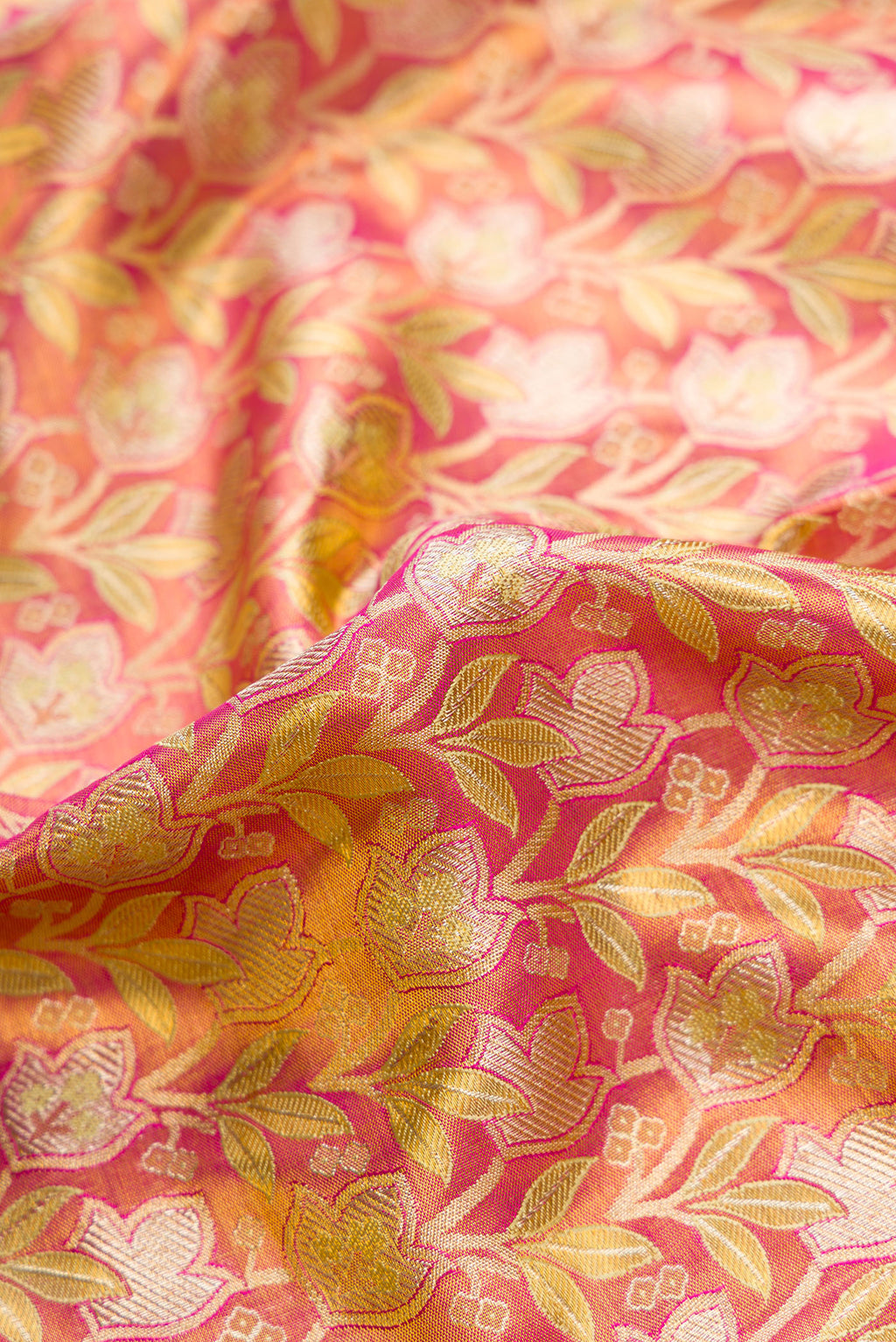 Close up of Pink Dual Tone Kanchipuram Tissue Silk Saree with Zari Brocade on the body and Zari Border.  displaying folds