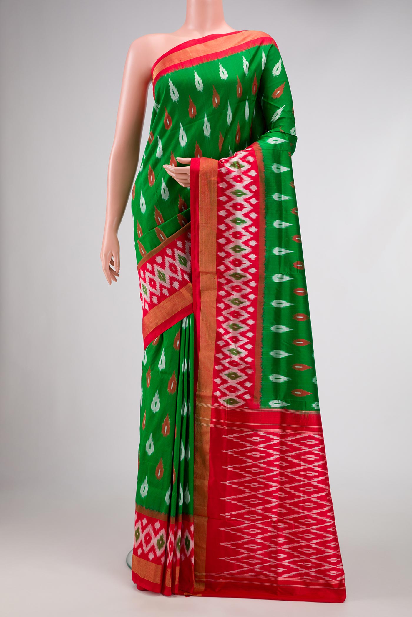 Green Pochampally Silk Saree with Pure Ikat on the body and Ikat Border displayed on a mannequin