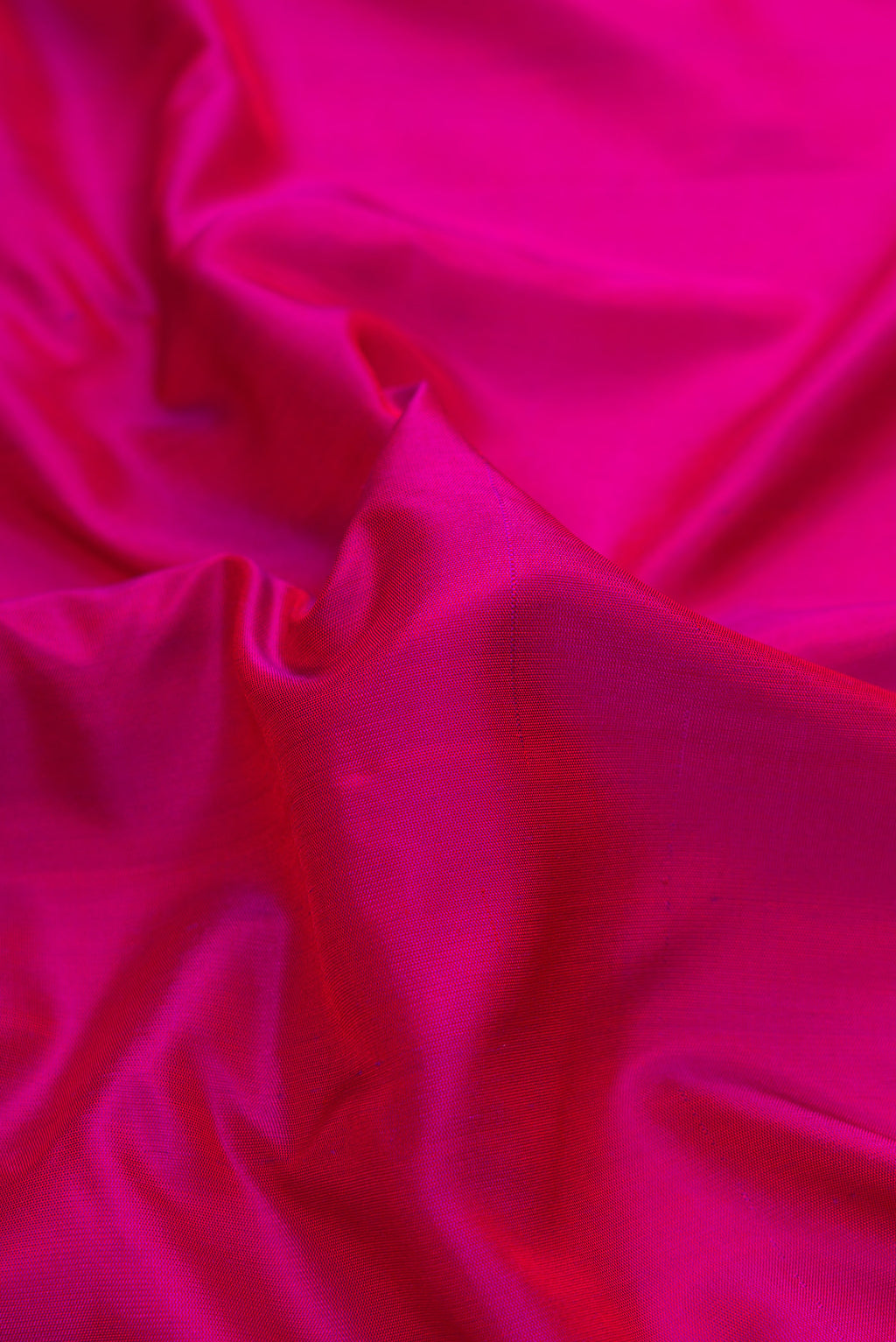 Close up of Pink Dual Tone Gadwal Silk Saree with Plain Body and Zari Border.  displaying folds