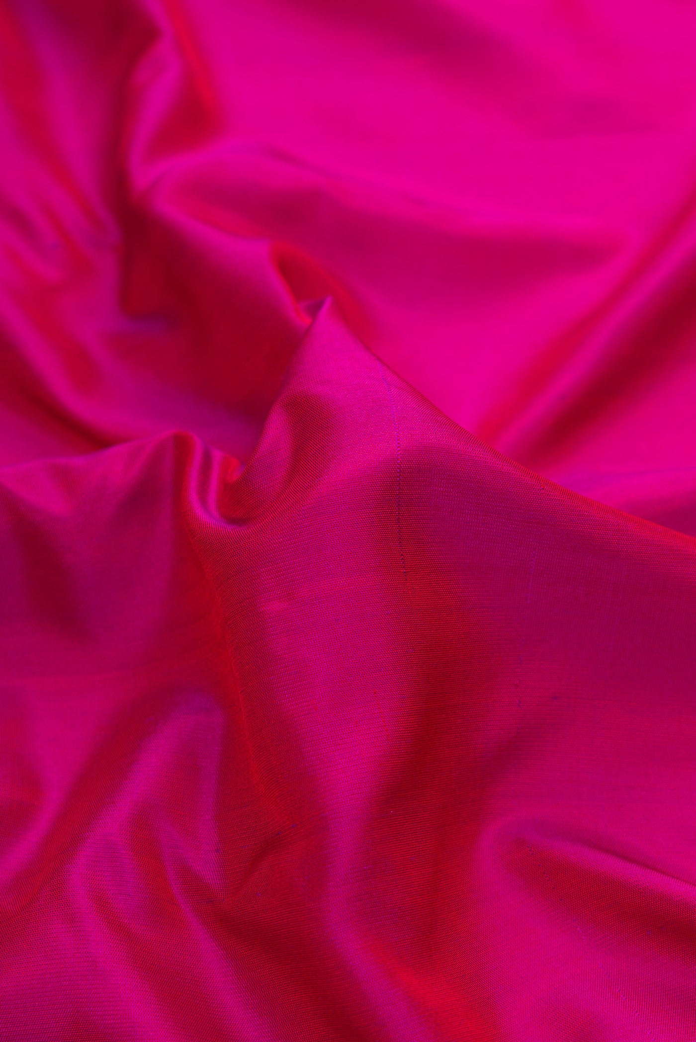 Close up of Pink Dual Tone Gadwal Silk Saree with Plain Body and Zari Border.  displaying folds