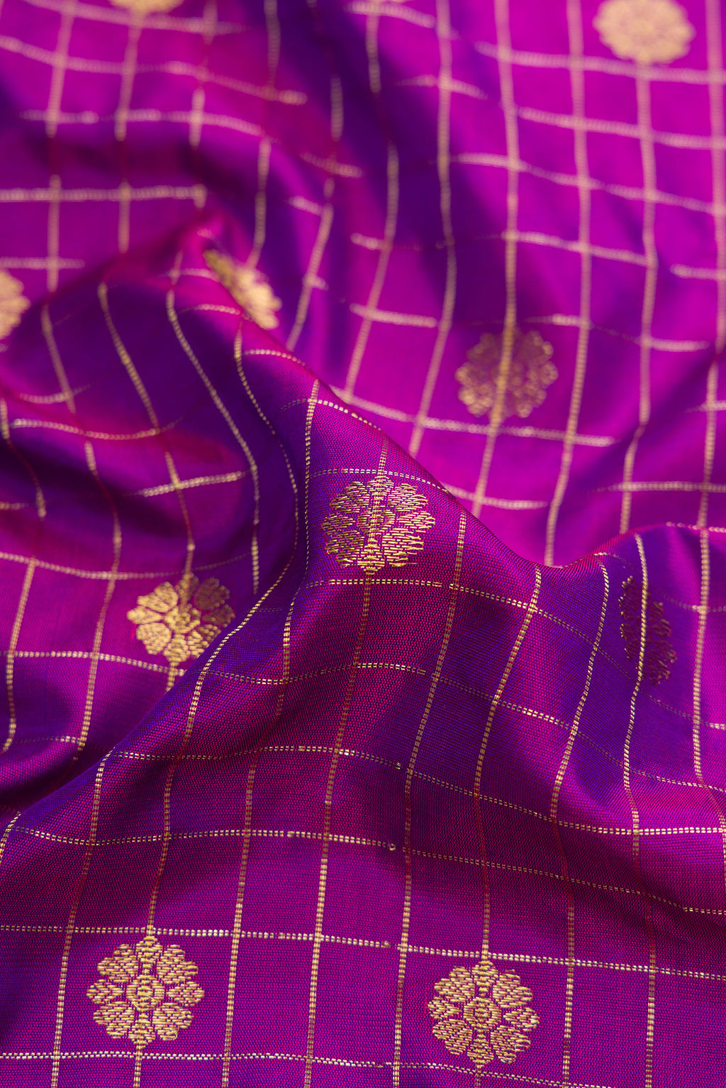 Close up of Purple Dual Tone Gadwal Silk Saree with Zari Butta on the body and Zari Border.  displaying folds