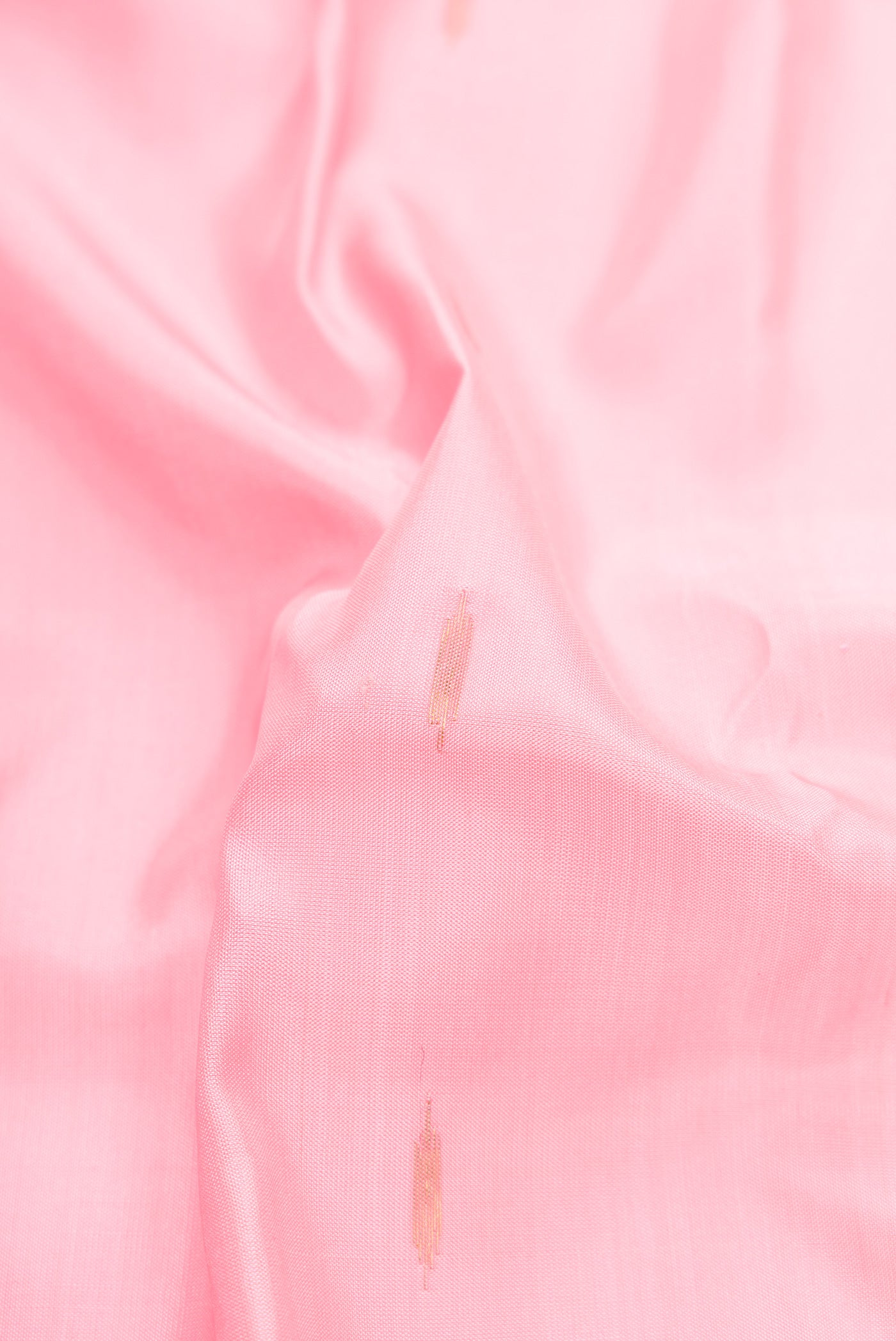 Close up of Pink Dual Tone Gadwal Silk Saree with Zari Butta on the body and Temple Border.  displaying folds