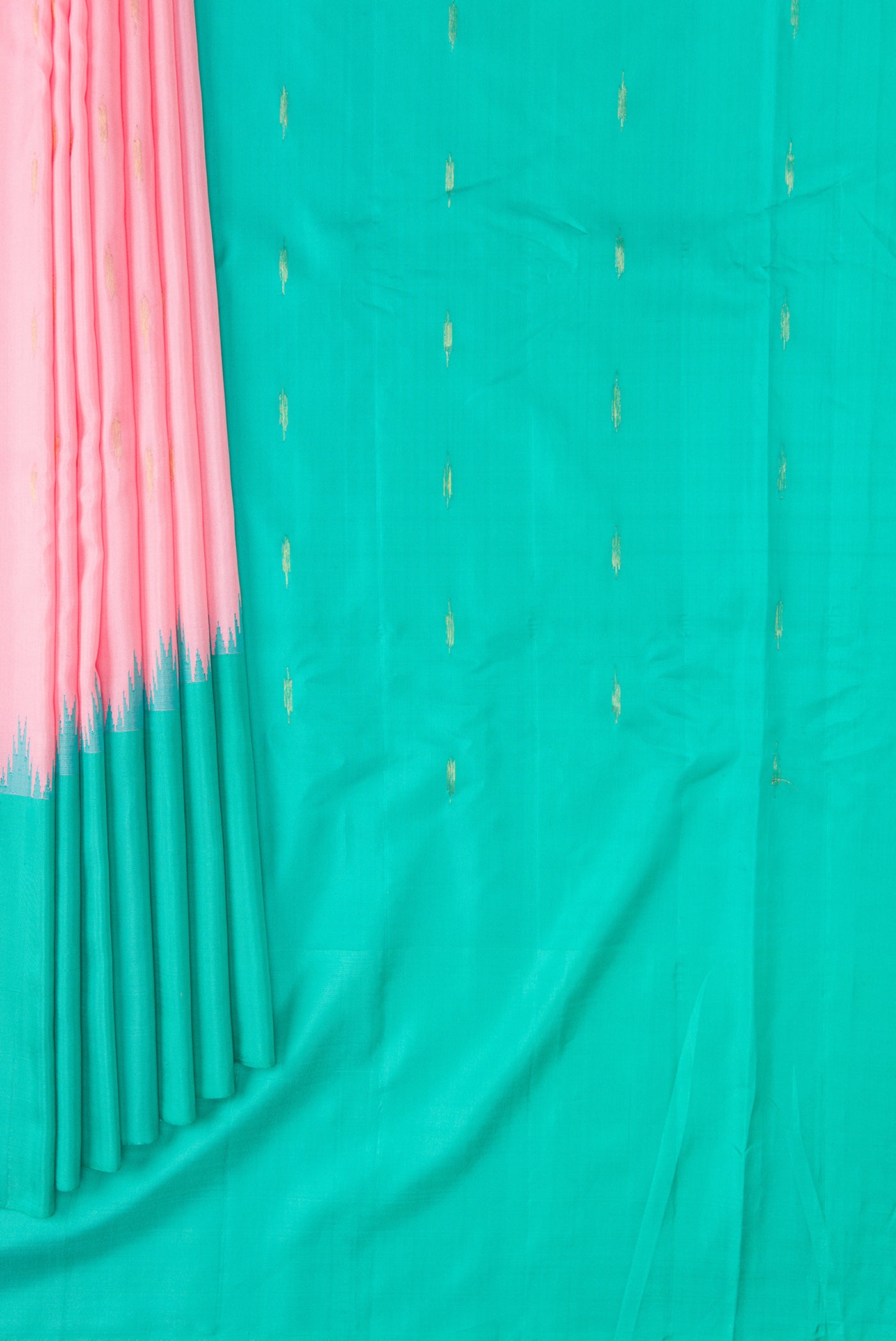 Pleats and pallu of Pink Dual Tone Gadwal Silk Saree with Zari Butta on the body and Temple Border. 