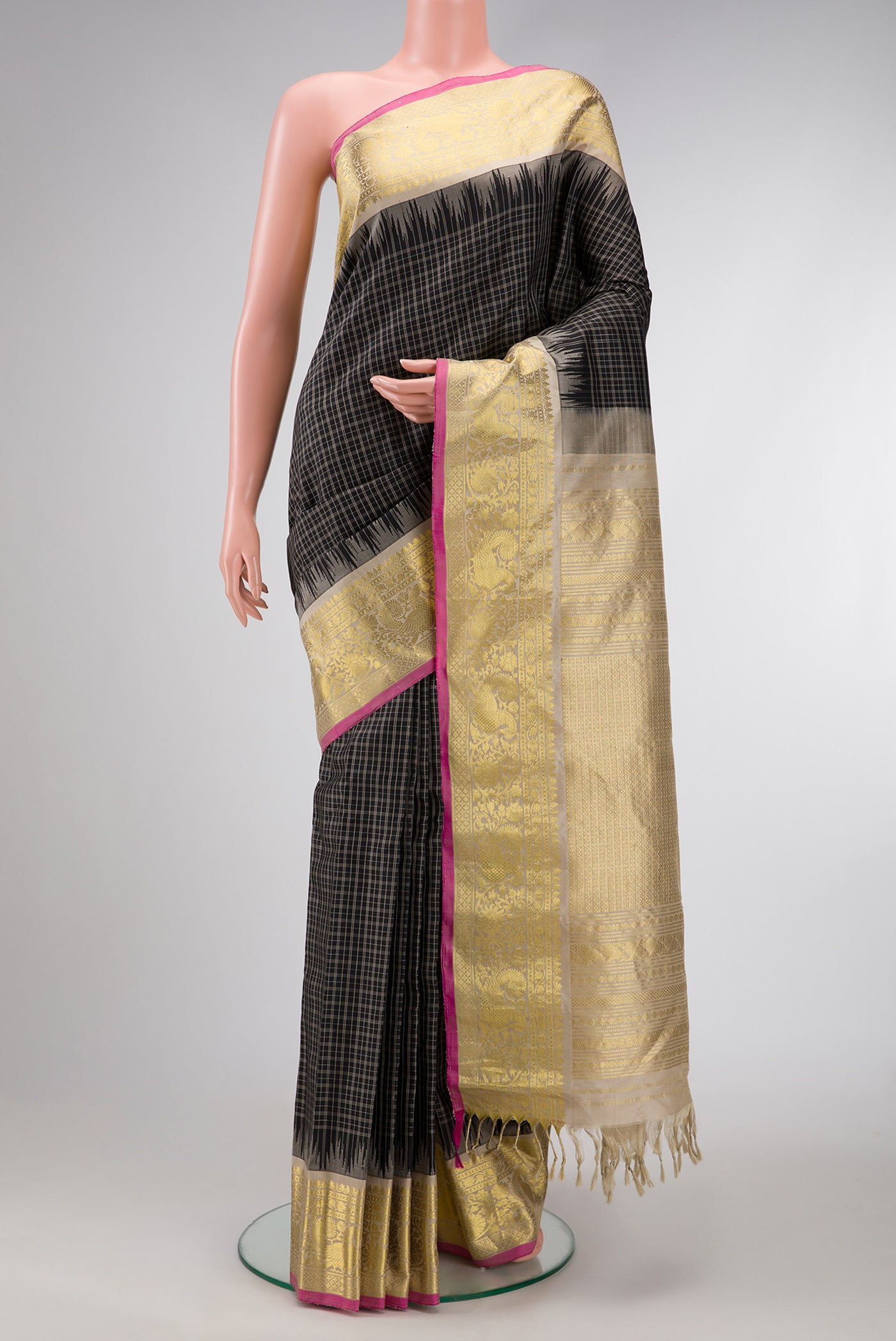 Black Dual Tone Gadwal Silk Saree with Checked design on the body and Temple Border.  displayed on a mannequin