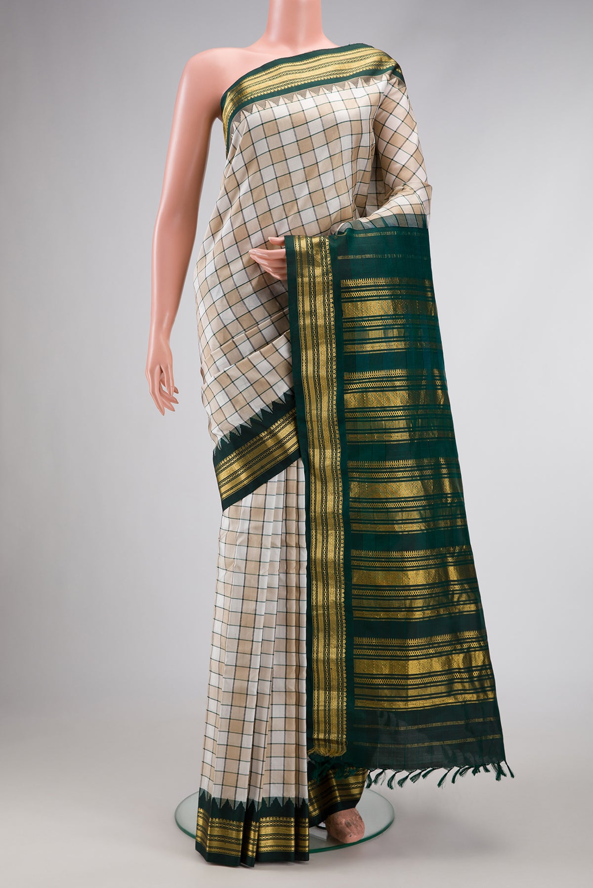 Beige and Off White Color Gadwal Silk Saree with Checked design on the body and Zari Border.  displayed on a mannequin
