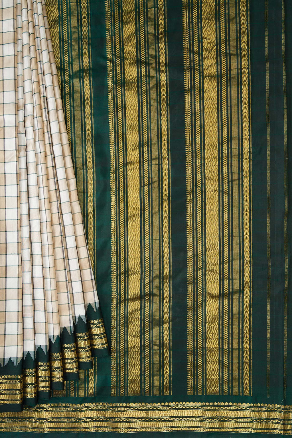 Pleats and pallu of Beige and Off White Color Gadwal Silk Saree with Checked design on the body and Zari Border. 