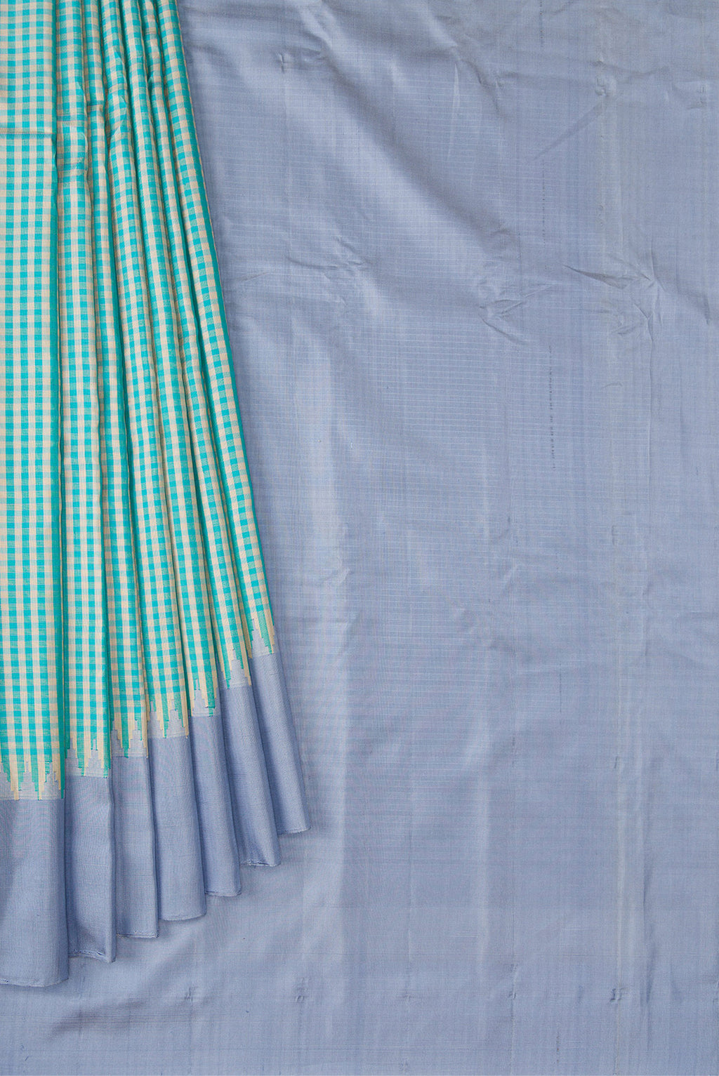 Pleats and pallu of Light Blue Dual Tone Gadwal Silk Saree with Checked design on the body and Plain Border. 