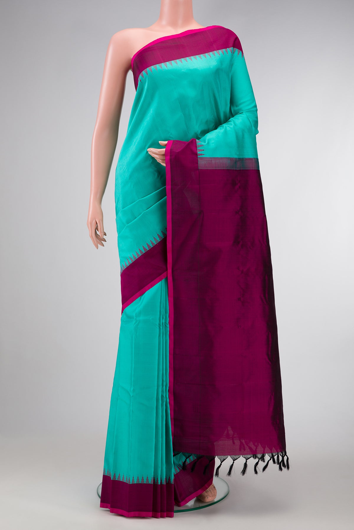 Sea Green Dual Tone Gadwal Silk Saree with Plain Body and Temple Border.  displayed on a mannequin