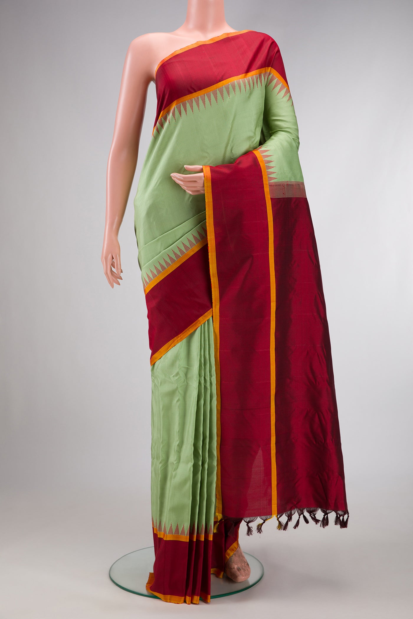 Light Green Dual Tone Gadwal Silk Saree with Zari Butta on the body and Zari Border.  displayed on a mannequin